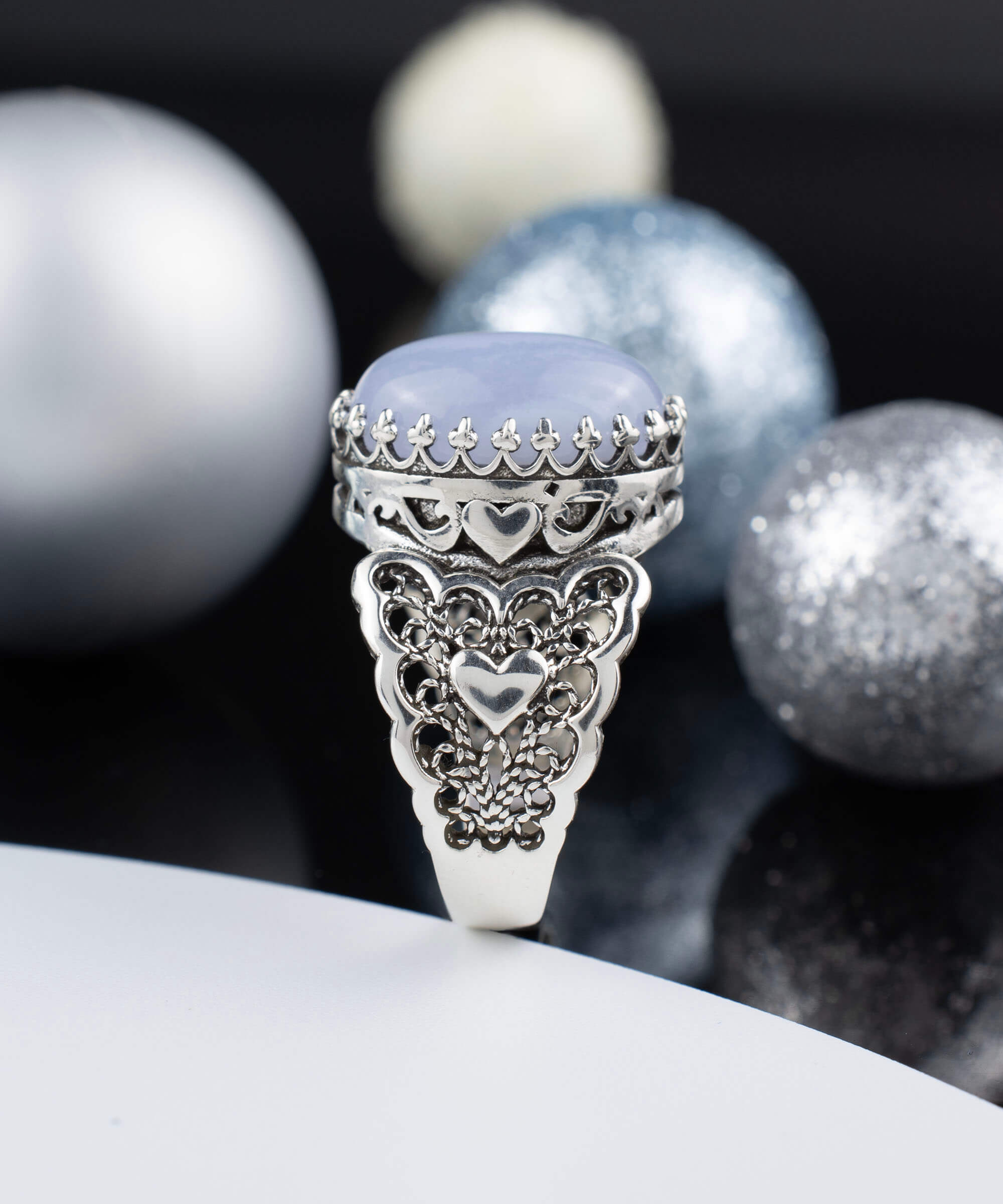 A beautiful Blue Lace Agate Gemstone Double Heart Ring made of 925 sterling silver with intricate filigree design.