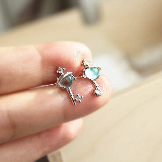Blue Planet Star Uranus Theme Key Shape Charm Necklace featuring a light blue crystal globe and sterling silver design.