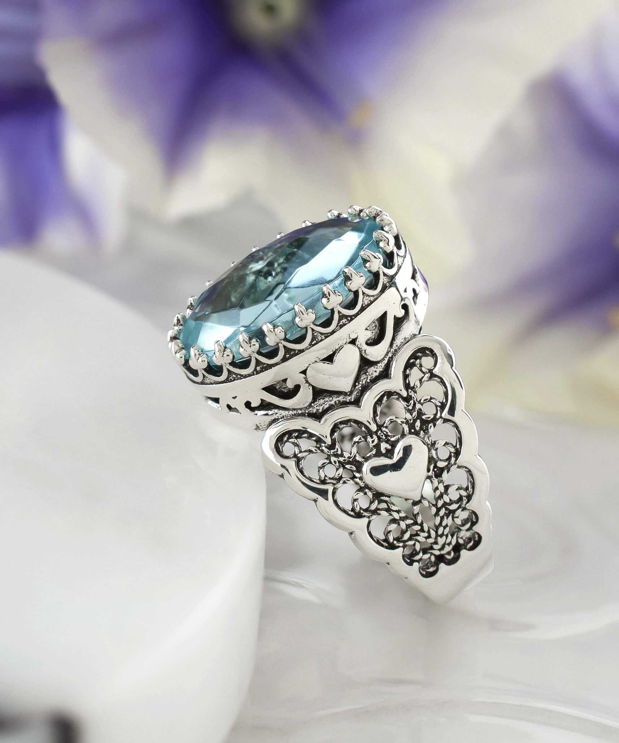 Elegant Blue Topaz Gemstone Double Heart Ring in 925 Sterling Silver with intricate filigree design.