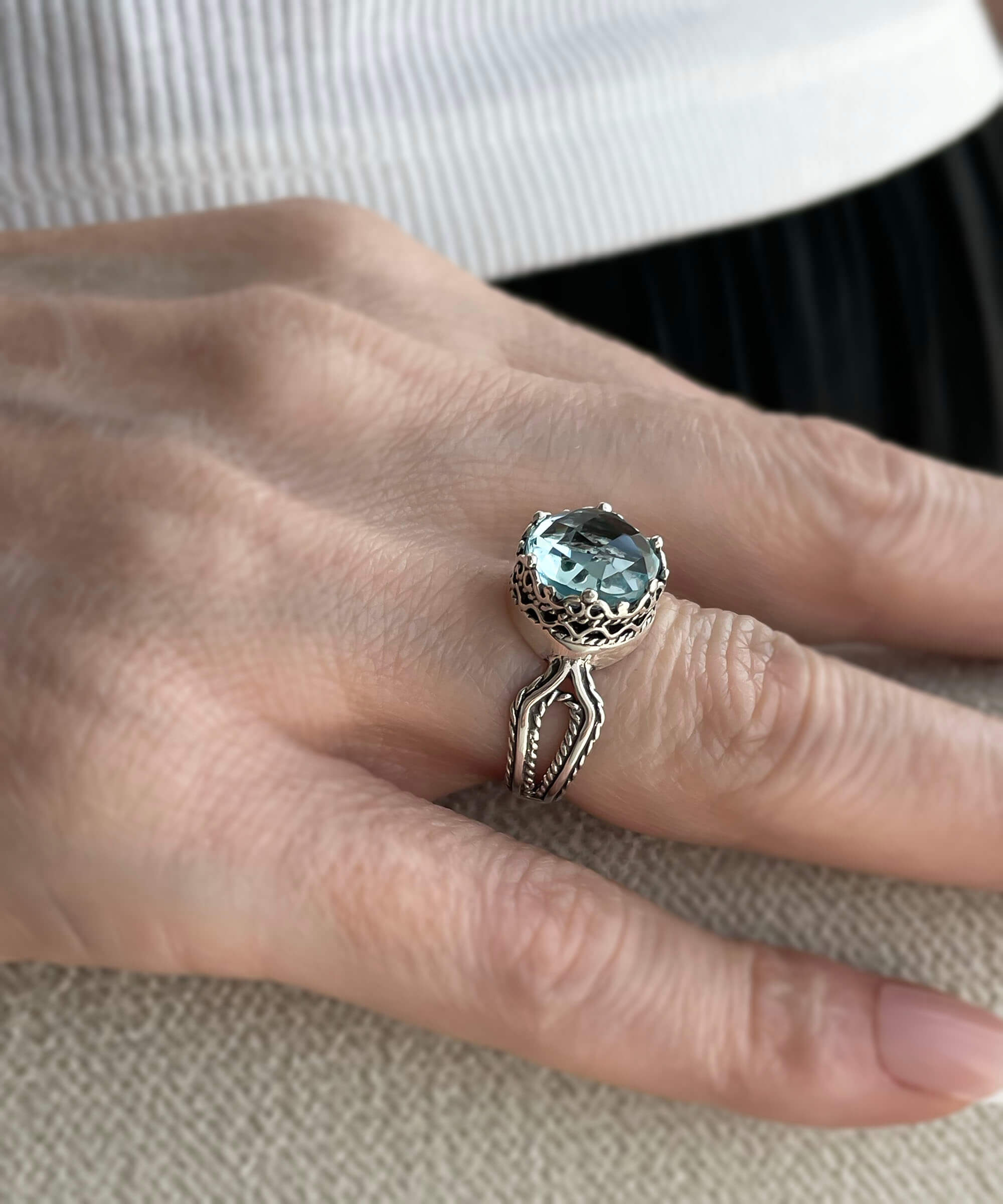 Elegant Blue Topaz Gemstone Filigree Art Cocktail Ring in Sterling Silver, showcasing intricate design and a stunning blue gemstone.