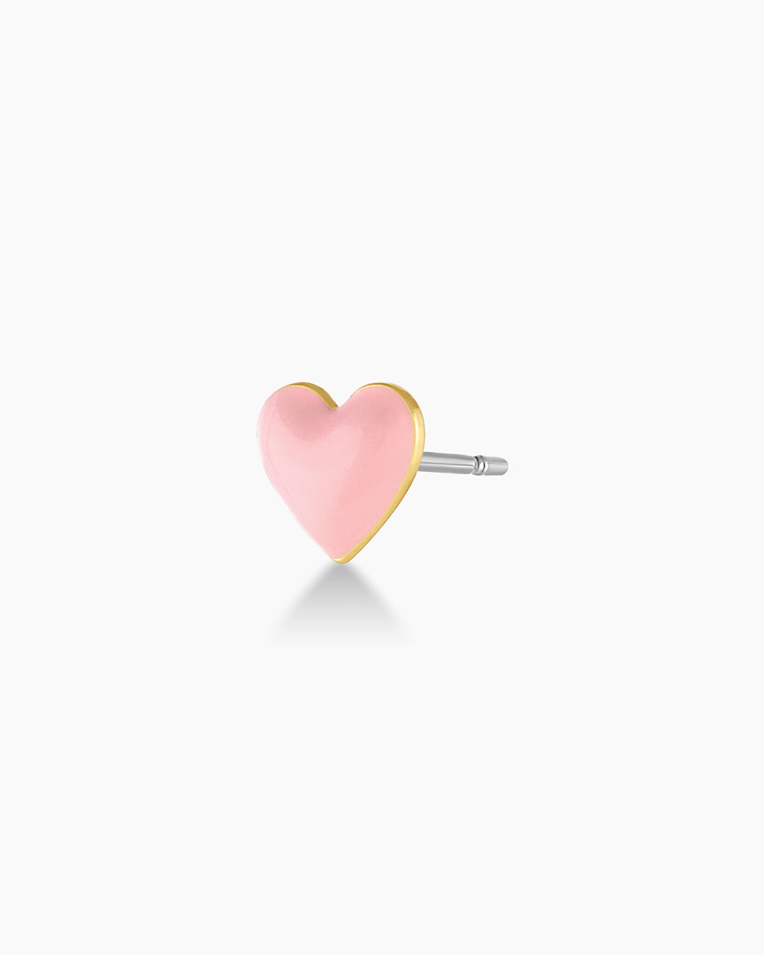 A pair of elegant Blush Heart Charm Stud earrings featuring delicate heart-shaped charms in a soft blush color.