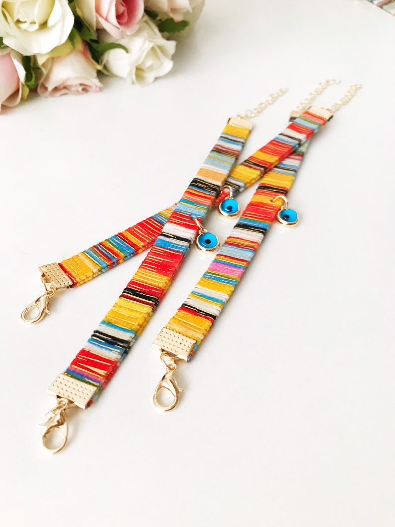 A beautifully handcrafted Bohemian Evil Eye Bracelet featuring a central evil eye charm and a braided design, perfect for protection and style.