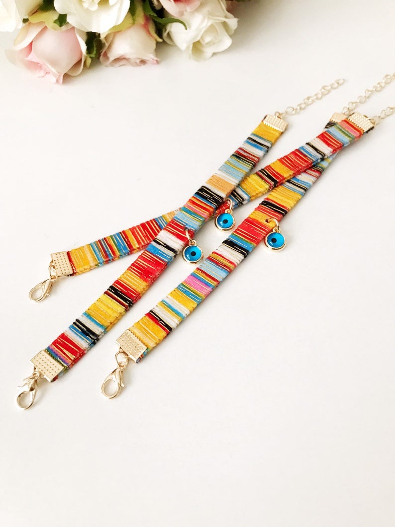 A beautifully handcrafted Bohemian Evil Eye Bracelet featuring a central evil eye charm and a braided design, perfect for protection and style.