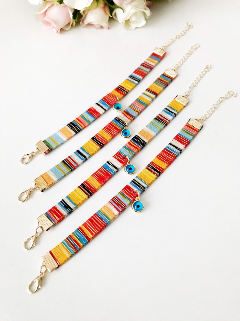 A beautifully handcrafted Bohemian Evil Eye Bracelet featuring a central evil eye charm and a braided design, perfect for protection and style.