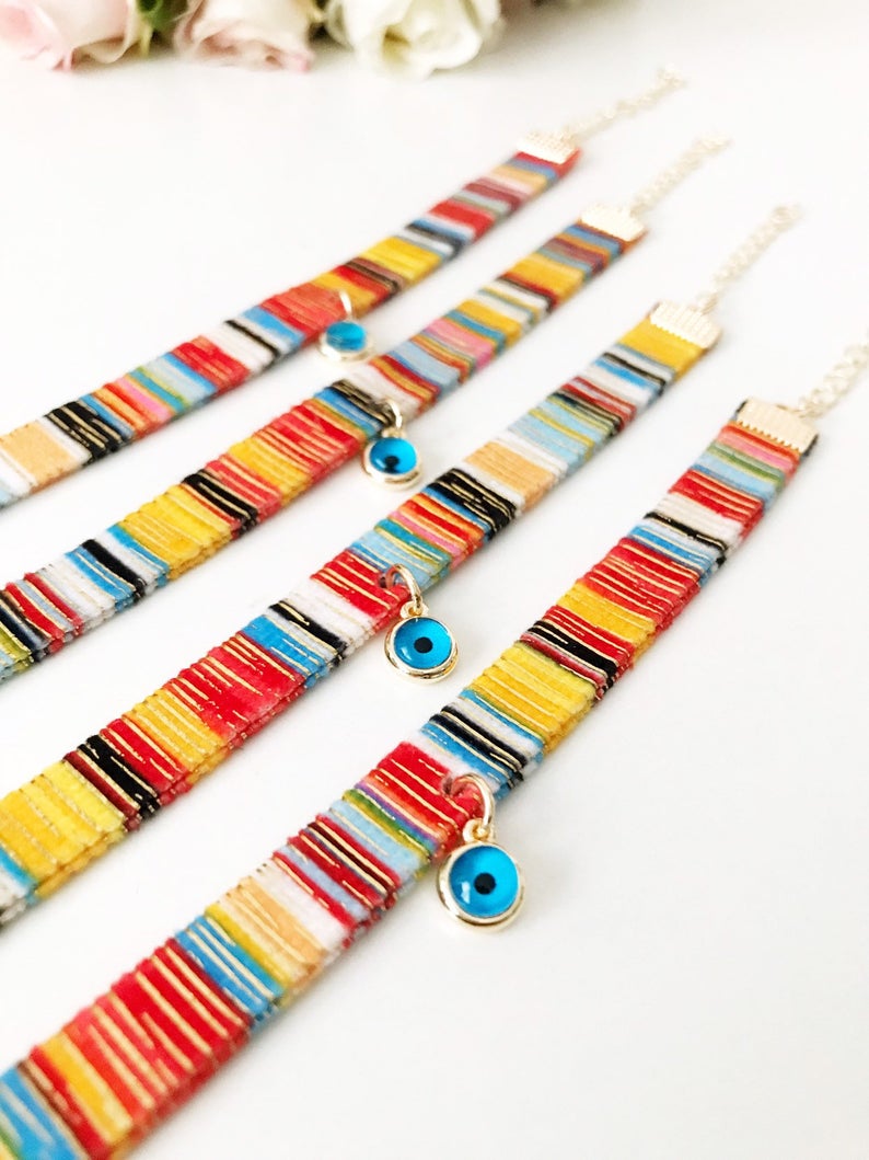 A beautifully handcrafted Bohemian Evil Eye Bracelet featuring a central evil eye charm and a braided design, perfect for protection and style.