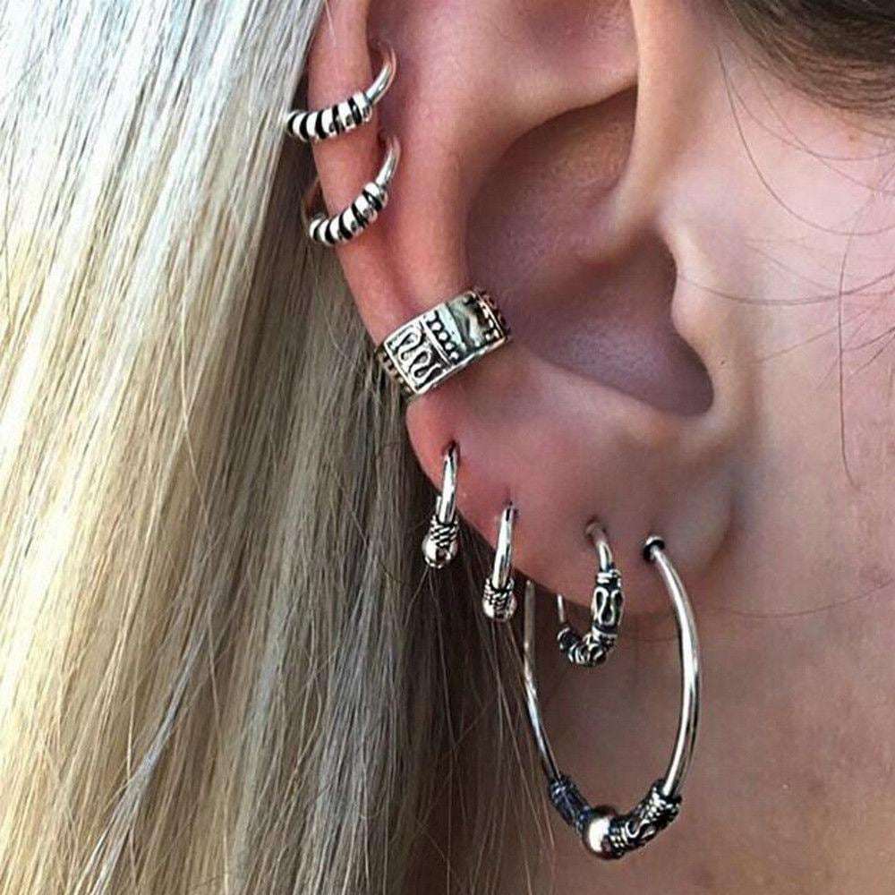 A stylish Bohemian Retro Style Silver Ear Clip Stud Hoop Earring Set featuring various hoop and cuff designs.