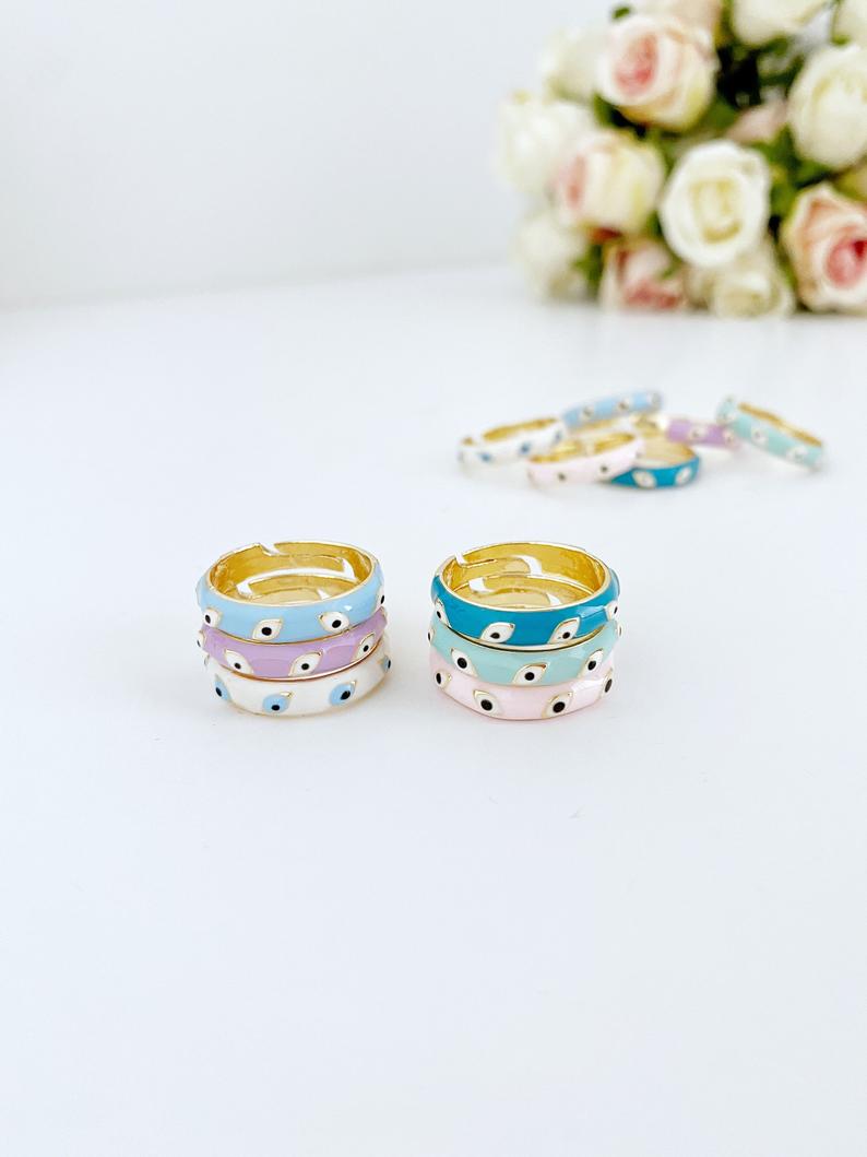Boho Evil Eye Ring featuring a gold adjustable band and colorful evil eye bead, symbolizing protection and luck.