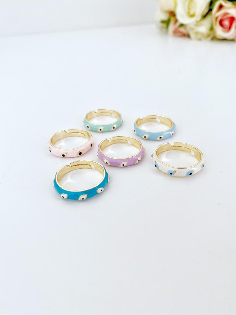Boho Evil Eye Ring featuring a gold adjustable band and colorful evil eye bead, symbolizing protection and luck.
