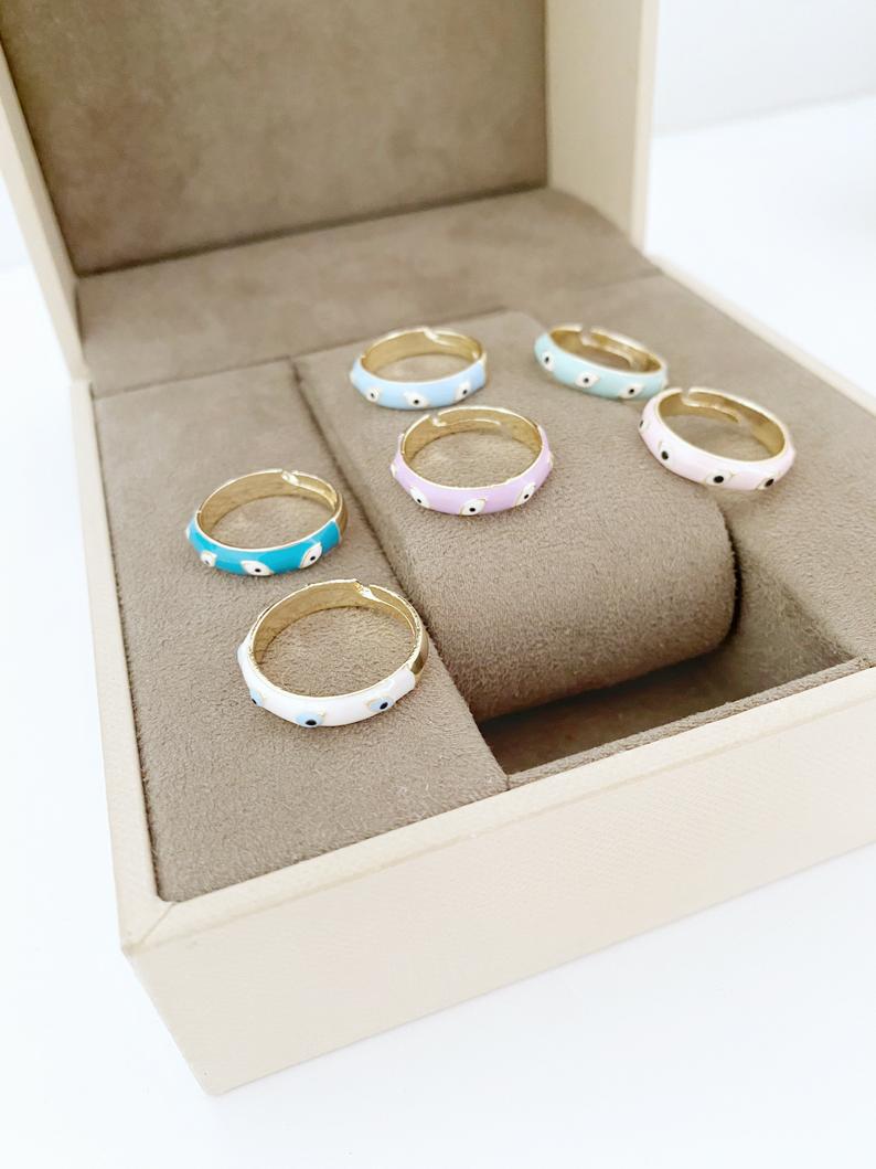 Boho Evil Eye Ring featuring a gold adjustable band and colorful evil eye bead, symbolizing protection and luck.