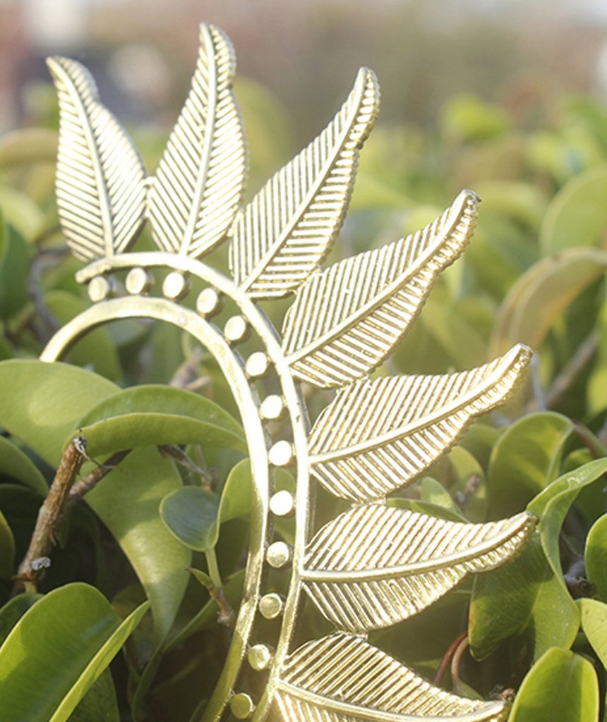 Boho Feather Earcuff in gold and silver, showcasing intricate feather design and adjustable fit, perfect for festivals and parties.