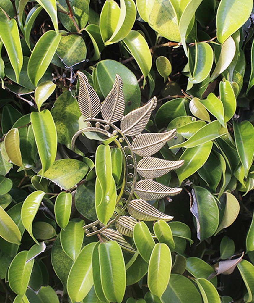 Boho Feather Earcuff in gold and silver, showcasing intricate feather design and adjustable fit, perfect for festivals and parties.