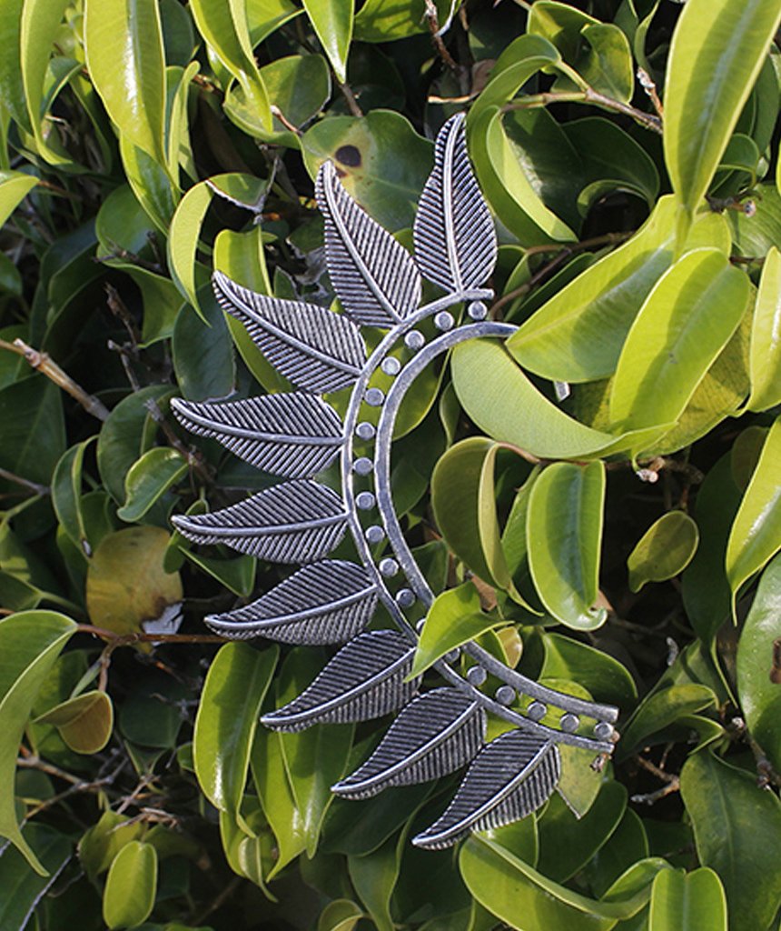 Boho Feather Earcuff in gold and silver, showcasing intricate feather design and adjustable fit, perfect for festivals and parties.