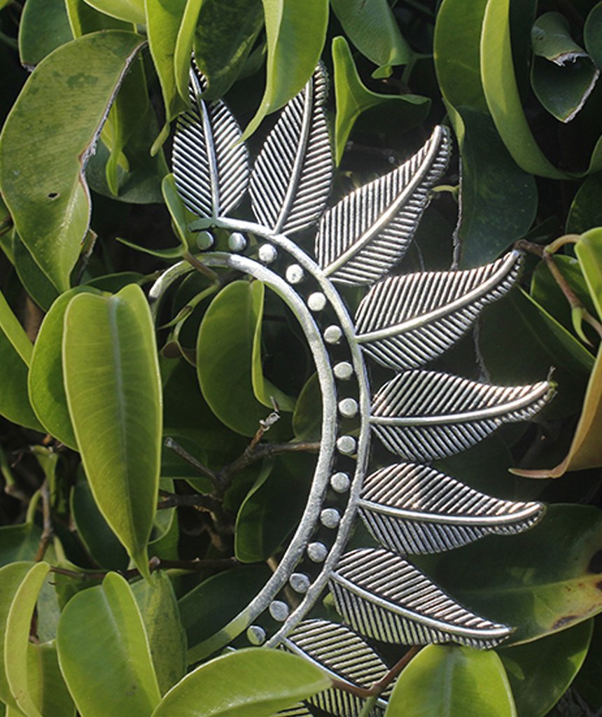 Boho Feather Earcuff in gold and silver, showcasing intricate feather design and adjustable fit, perfect for festivals and parties.