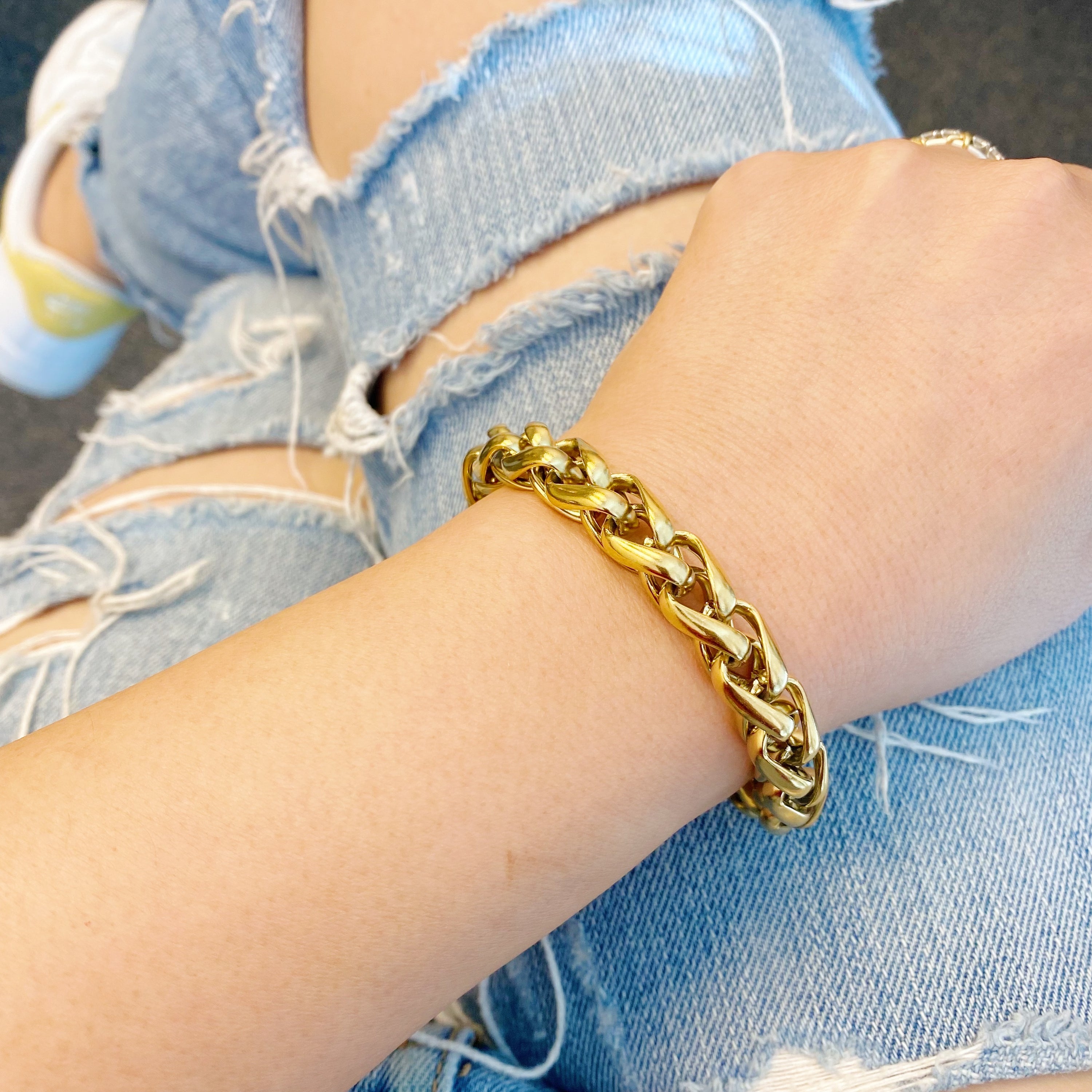 A stylish Bold And Edgy Chain Bracelet featuring small interconnected links, 18k gold plated stainless steel, perfect for layering or as a statement piece.