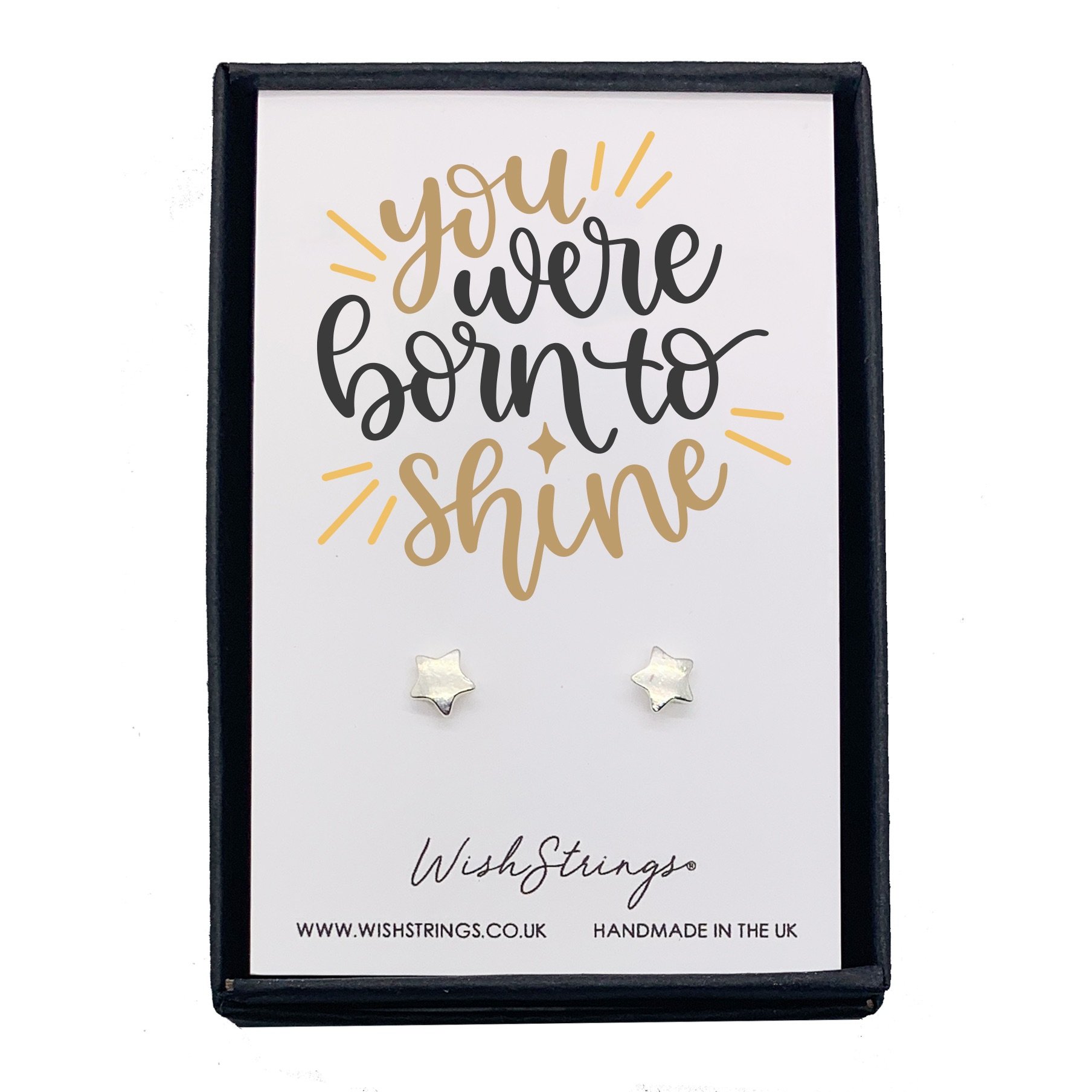 A pair of BORN TO SHINE earrings displayed in a luxurious black gift box, featuring a quality card with an inspirational design.