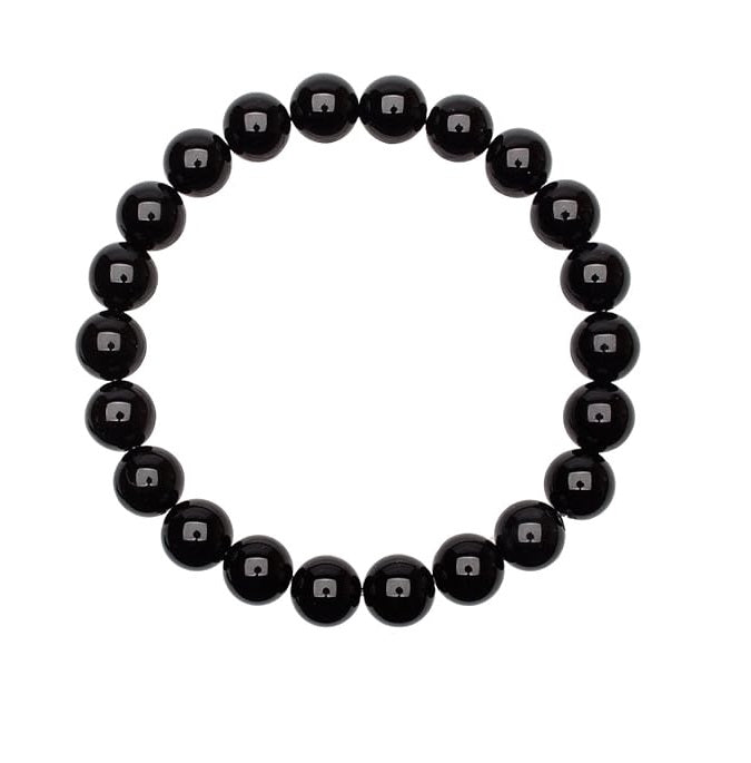 Bracelet en onyx noir de 8mm sur fond neutre, mettant en valeur ses perles brillantes et son cordon élastique ajustable.