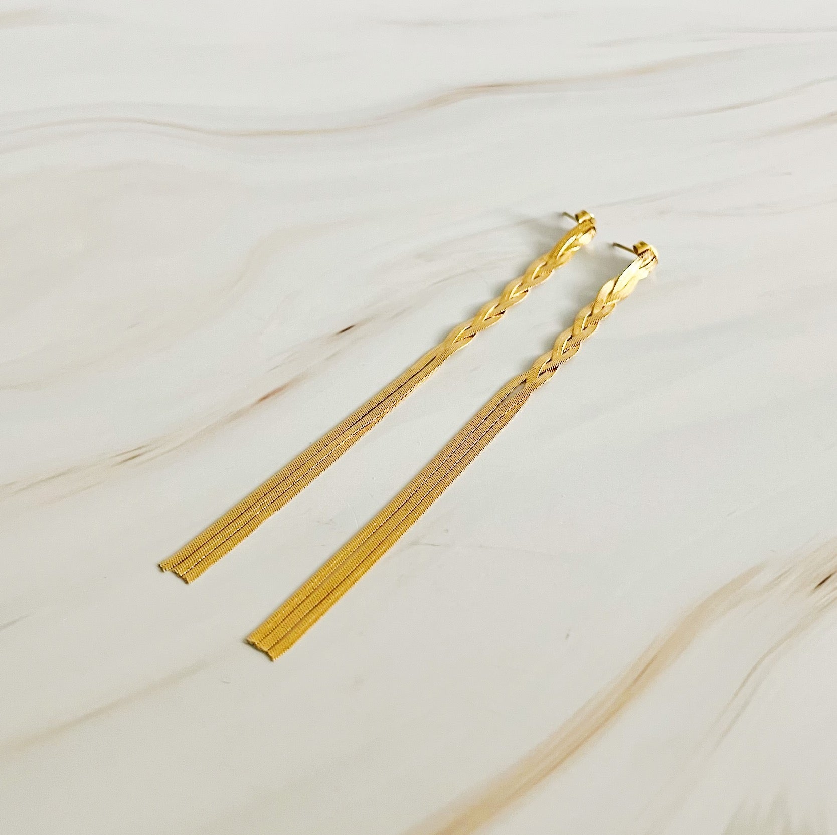 Elegant Braided Herringbone Chain Drop Earrings in 18k gold plating, showcasing a unique braided design and drop style.