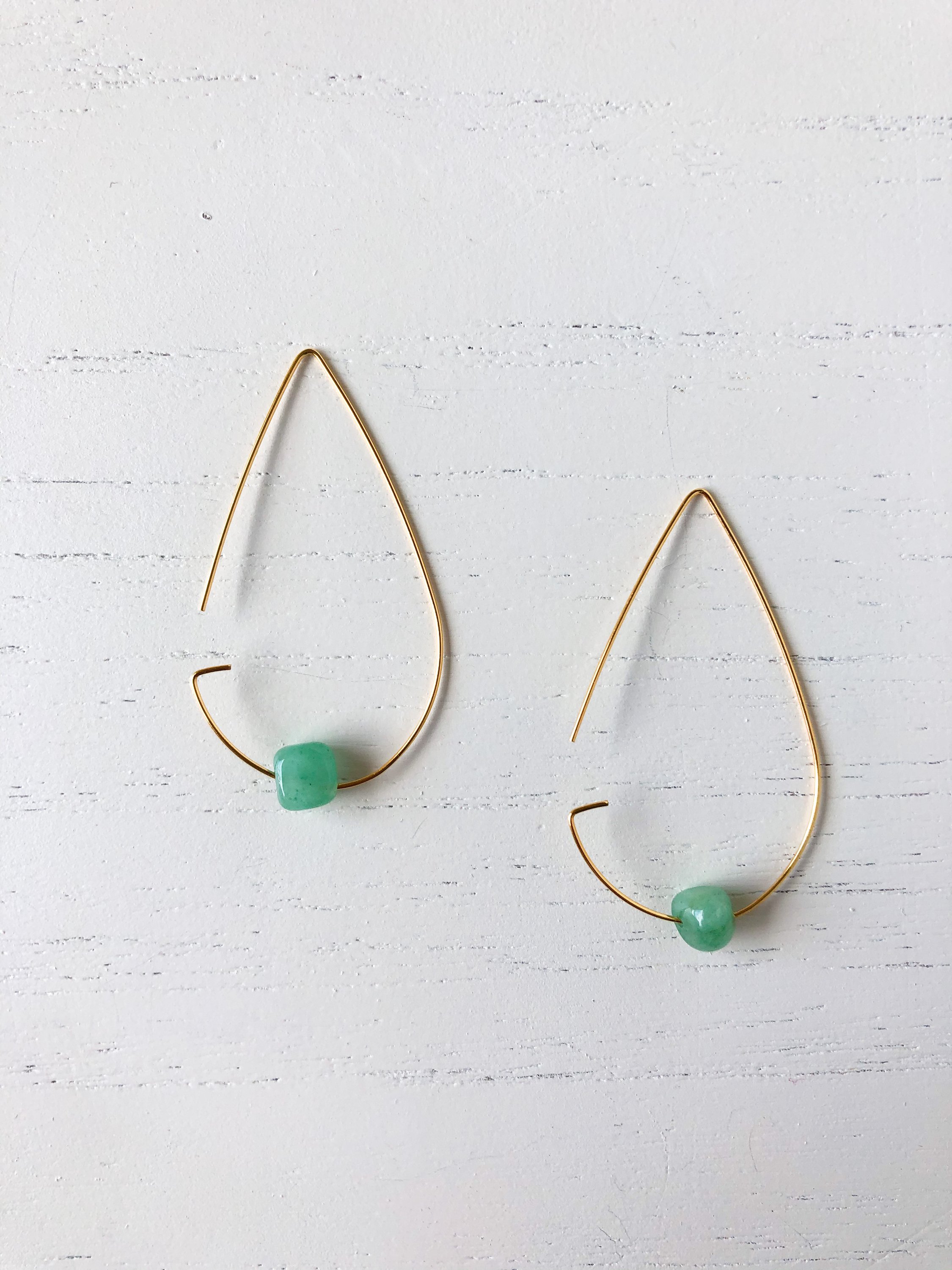 Brass tear drop threader earrings featuring jade stone, elegantly designed for stylish wear.