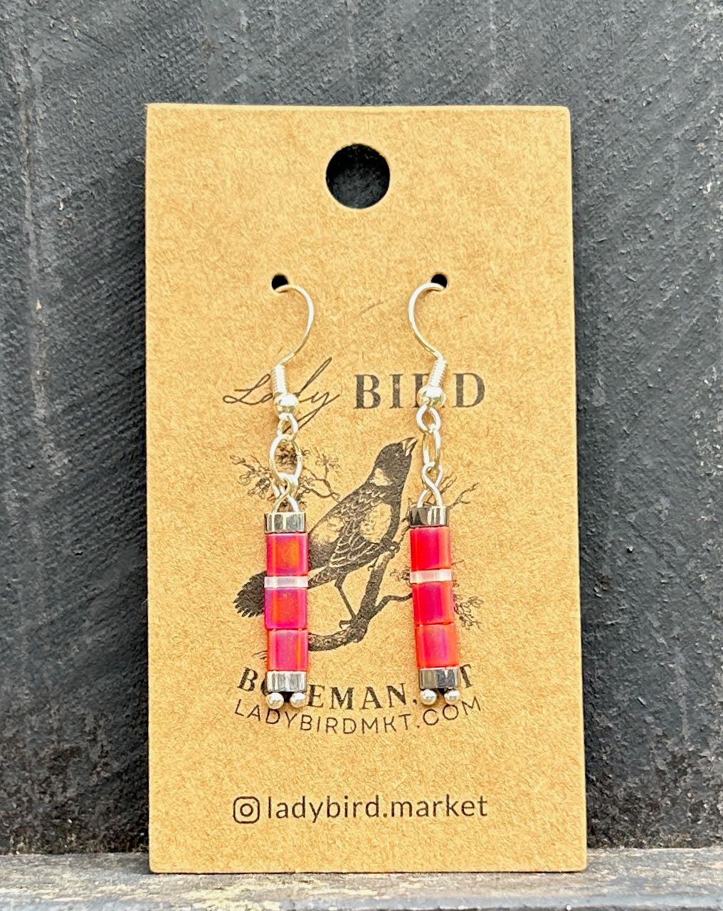 Bright Pink and White Striped Silver Tila Bead Earrings, showcasing vibrant colors and unique design.