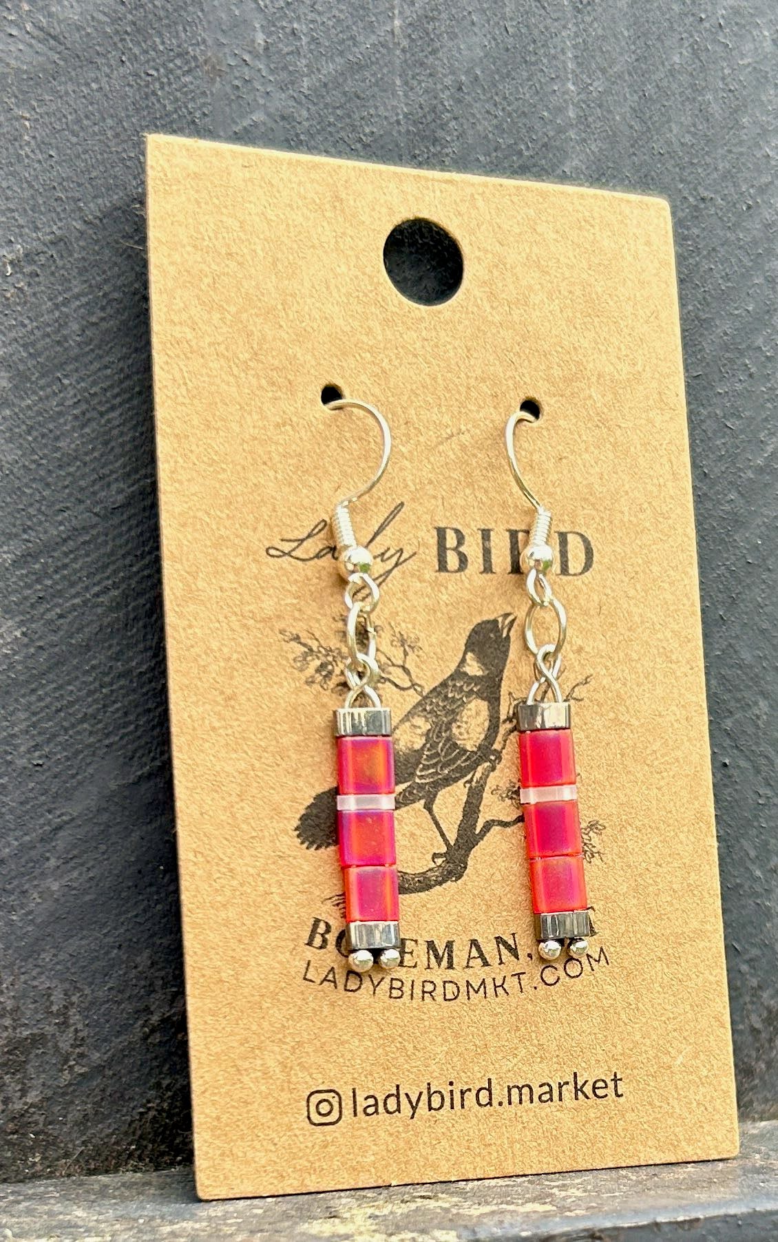 Bright Pink and White Striped Silver Tila Bead Earrings, showcasing vibrant colors and unique design.