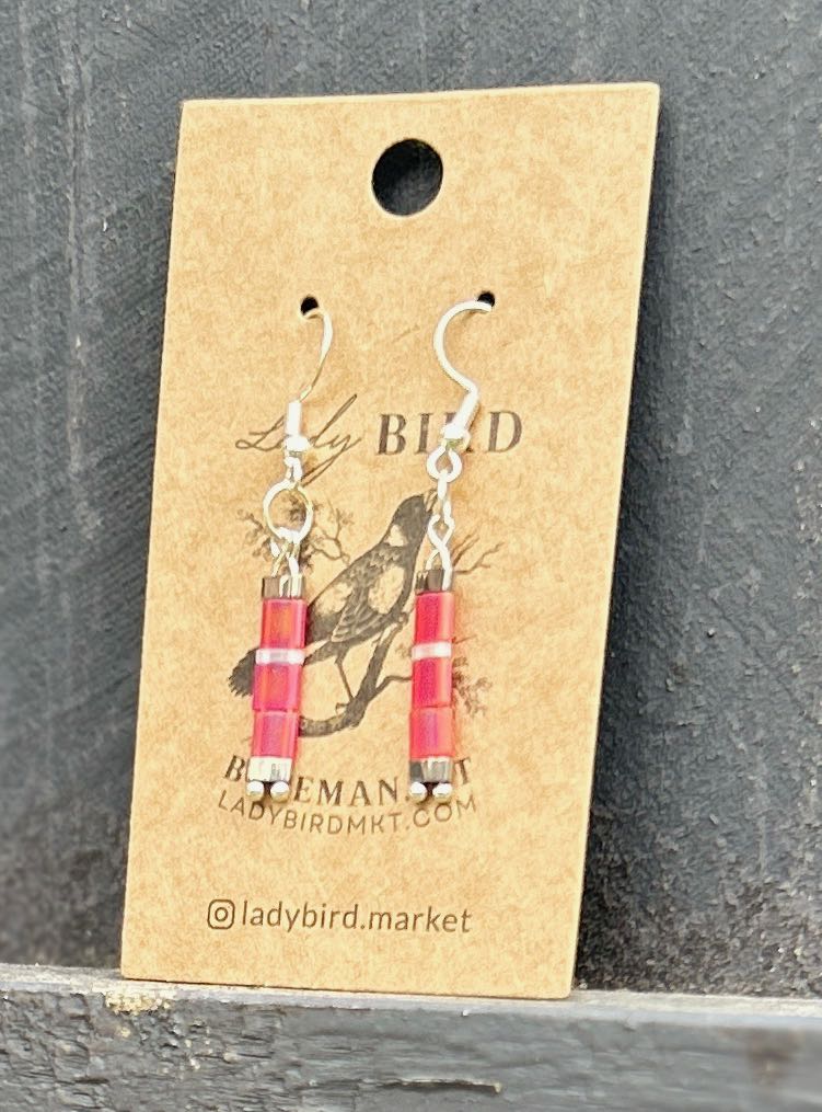 Bright Pink and White Striped Silver Tila Bead Earrings, showcasing vibrant colors and unique design.