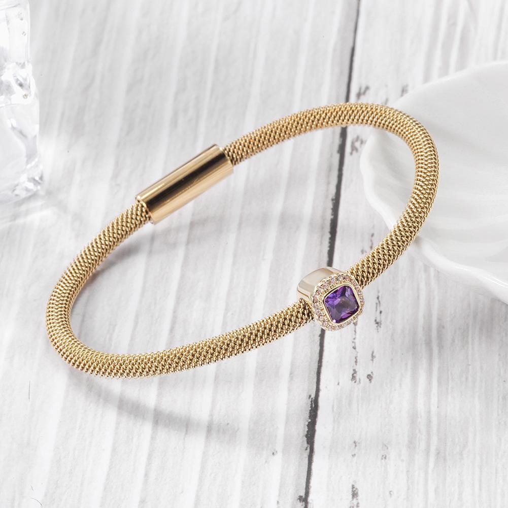 Brilliant Cut CZ Halo Bangle Bracelet featuring sparkling cubic zirconia stones set in 14K gold PVD plated surgical stainless steel.