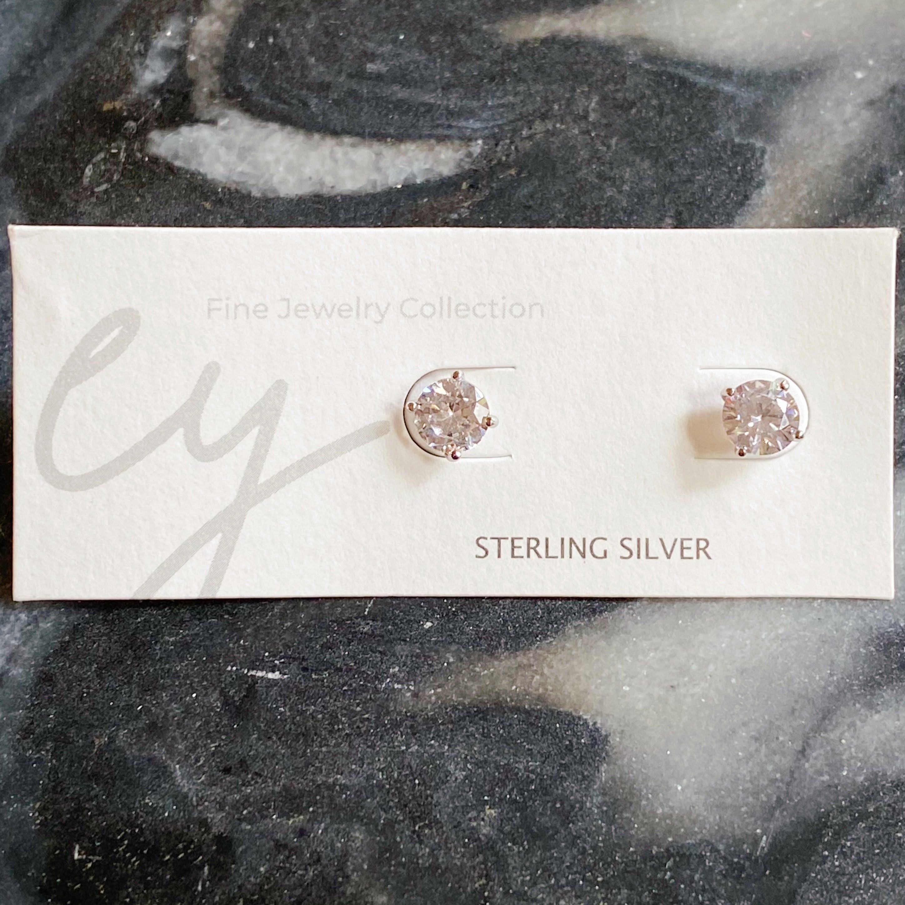 Brilliant Cut Sterling Silver Stud Earrings featuring sparkling Cubic Zirconia stones set in 925 Sterling Silver with rhodium plating.