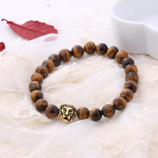 Brown natural stone lion head stretch bracelet with 18K gold plating, showcasing intricate details and a comfortable fit.