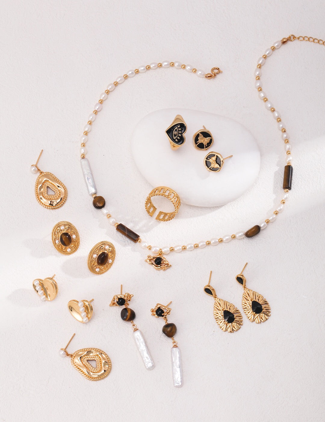 Butterfly Print Black Onyx Stone Stud earrings featuring a gold vermeil finish, handcrafted from black agate, showcasing a delicate butterfly design.