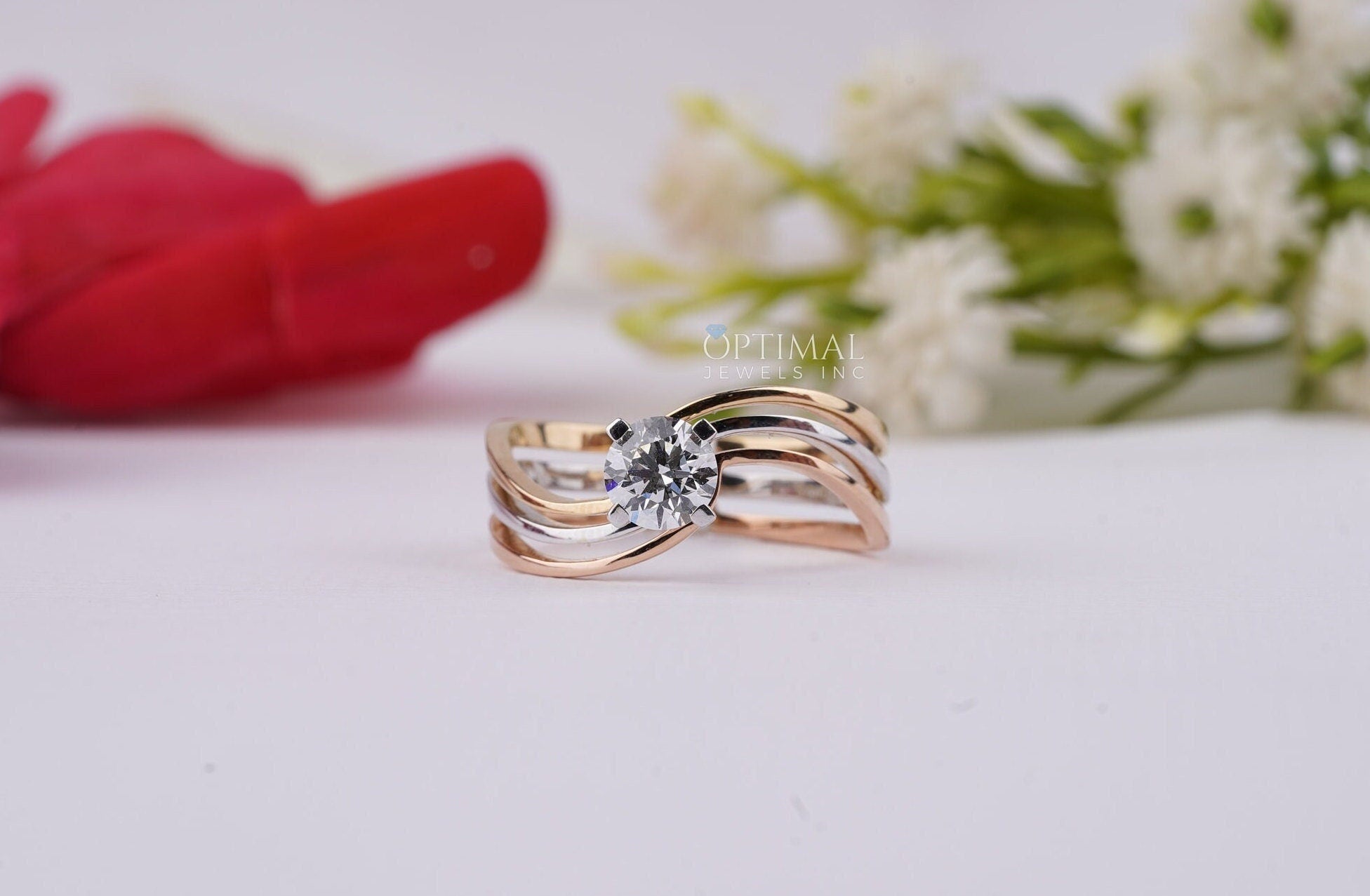 Bypass Three Band Engagement Ring featuring a 0.60 Ctw round cut lab diamond, elegantly designed with three intertwining bands.