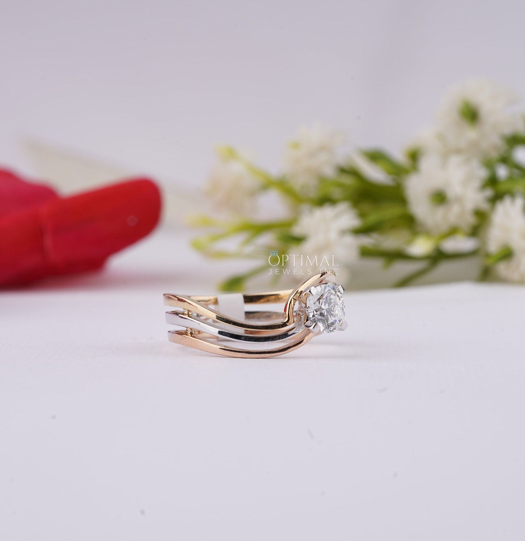 Bypass Three Band Engagement Ring featuring a 0.60 Ctw round cut lab diamond, elegantly designed with three intertwining bands.