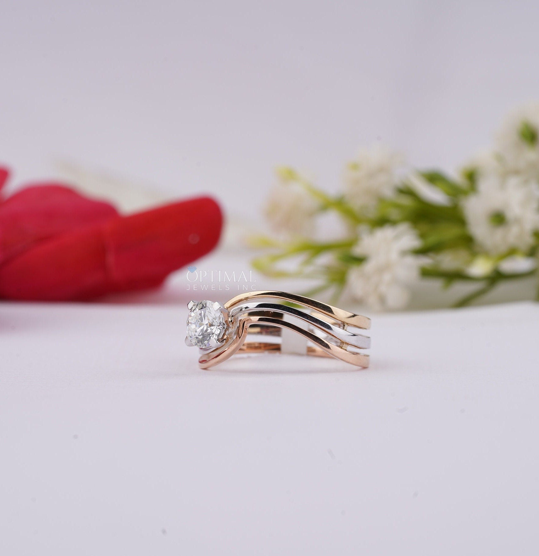 Bypass Three Band Engagement Ring featuring a 0.60 Ctw round cut lab diamond, elegantly designed with three intertwining bands.