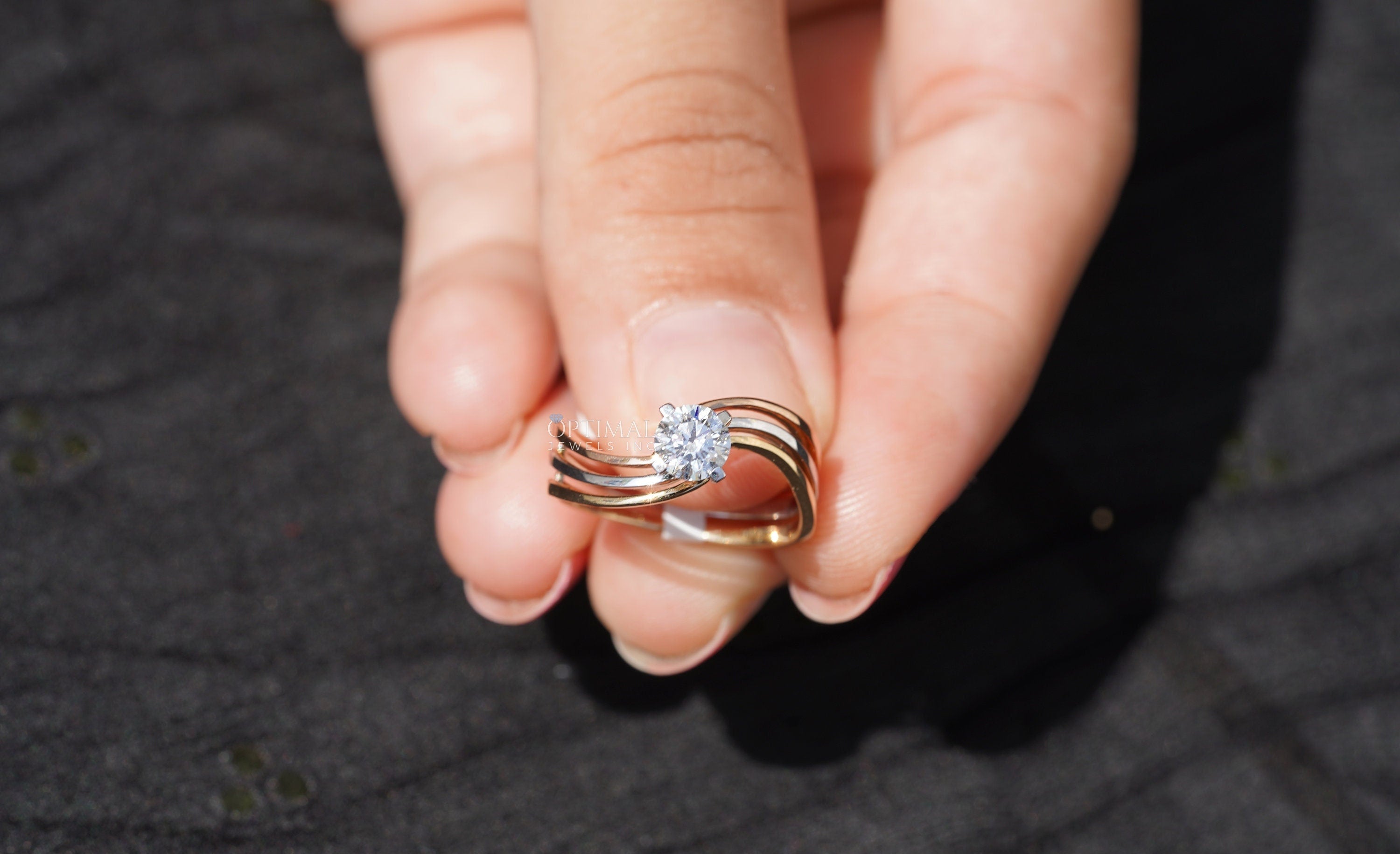 Bypass Three Band Engagement Ring featuring a 0.60 Ctw round cut lab diamond, elegantly designed with three intertwining bands.