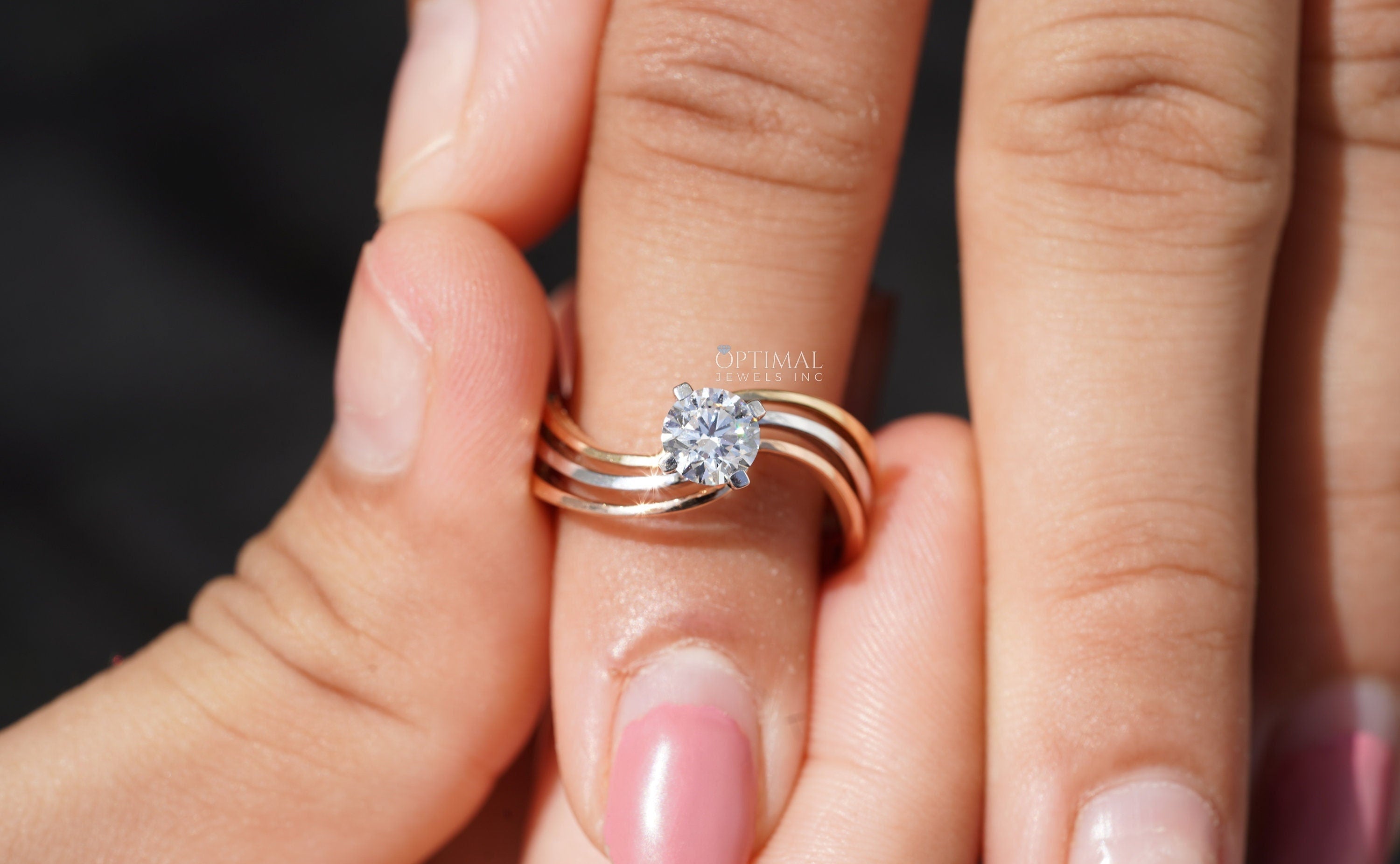 Bypass Three Band Engagement Ring featuring a 0.60 Ctw round cut lab diamond, elegantly designed with three intertwining bands.