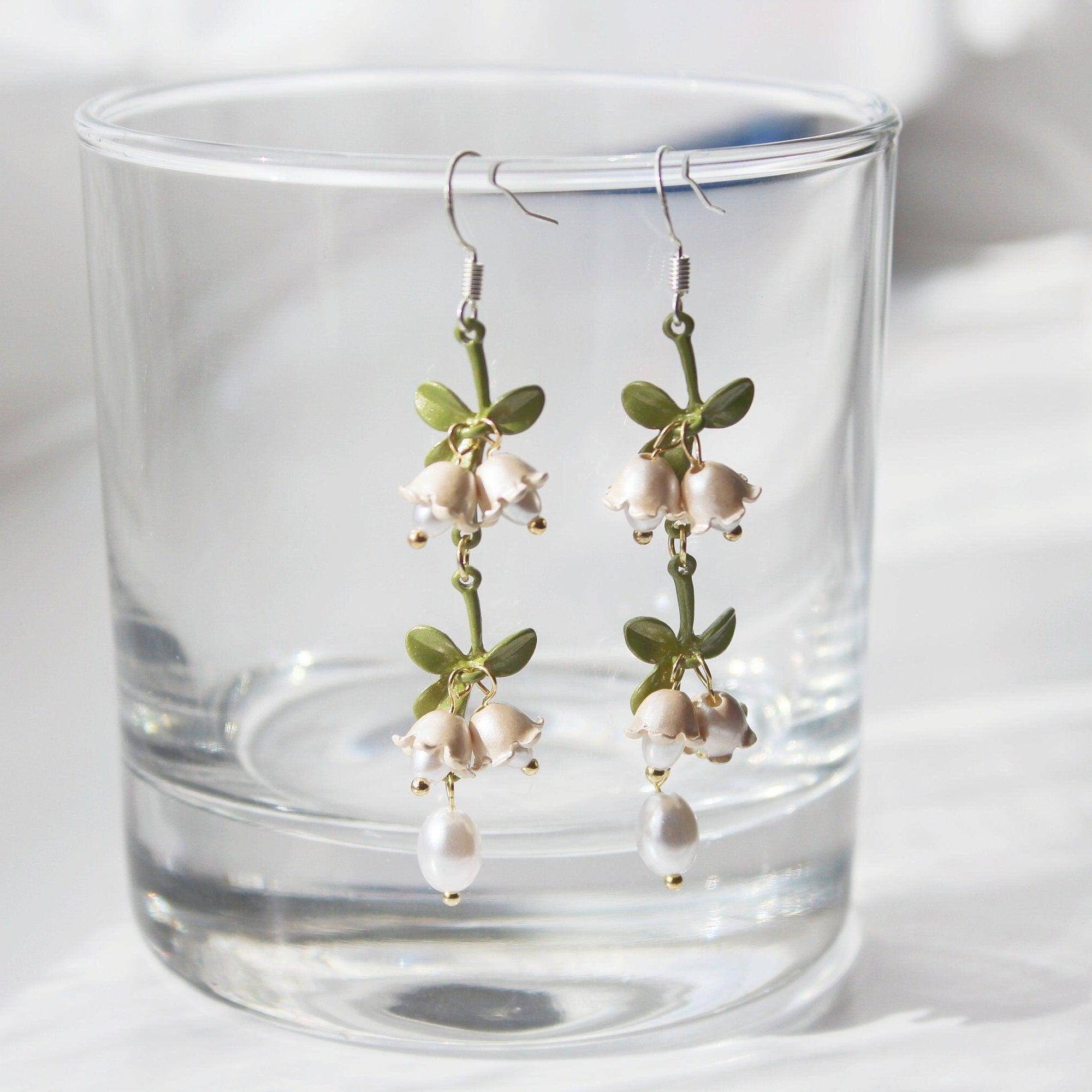 Elegant Campanula Bellflower Drop Earrings featuring bell-shaped flowers and green leaves, crafted from sterling silver and bronze.