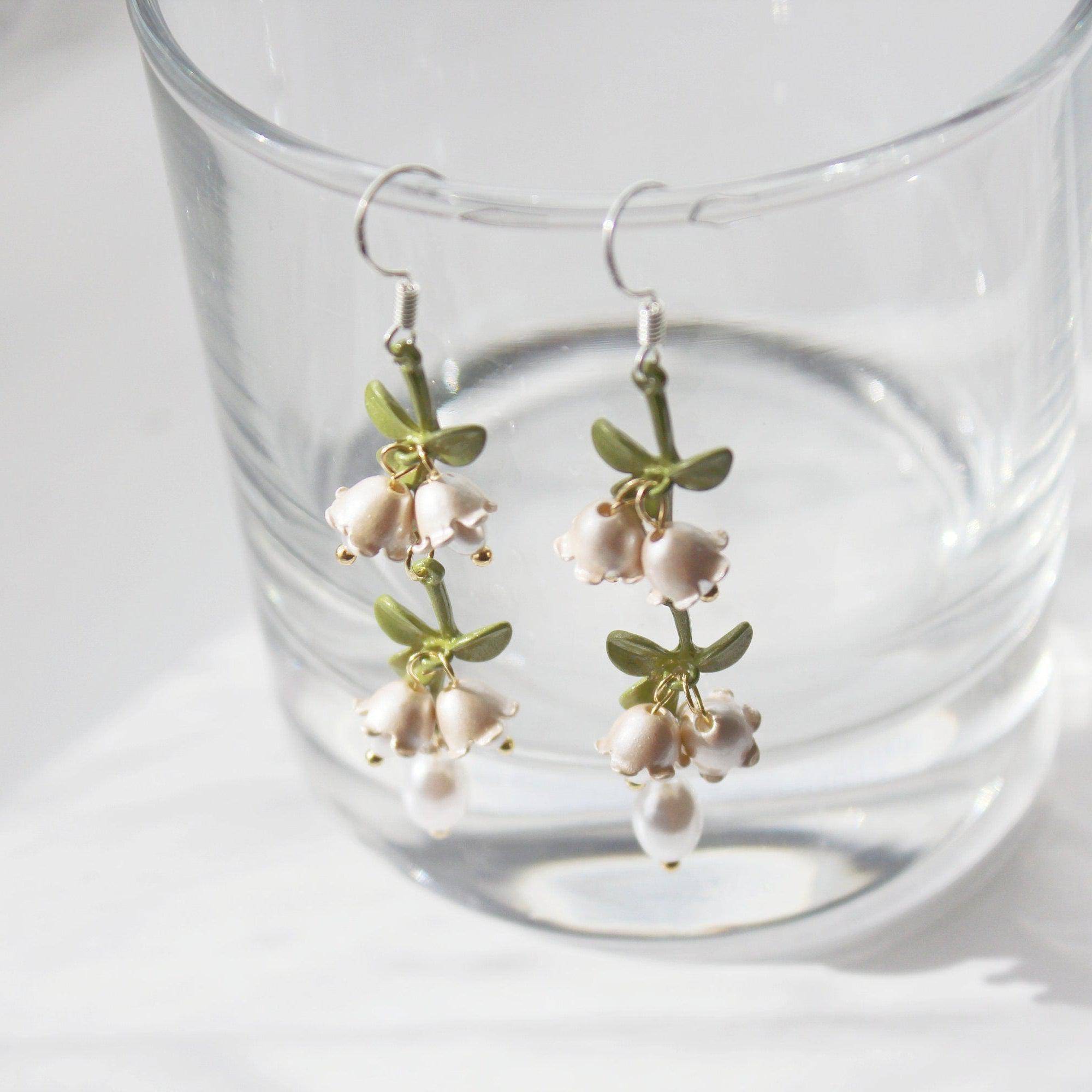 Elegant Campanula Bellflower Drop Earrings featuring bell-shaped flowers and green leaves, crafted from sterling silver and bronze.