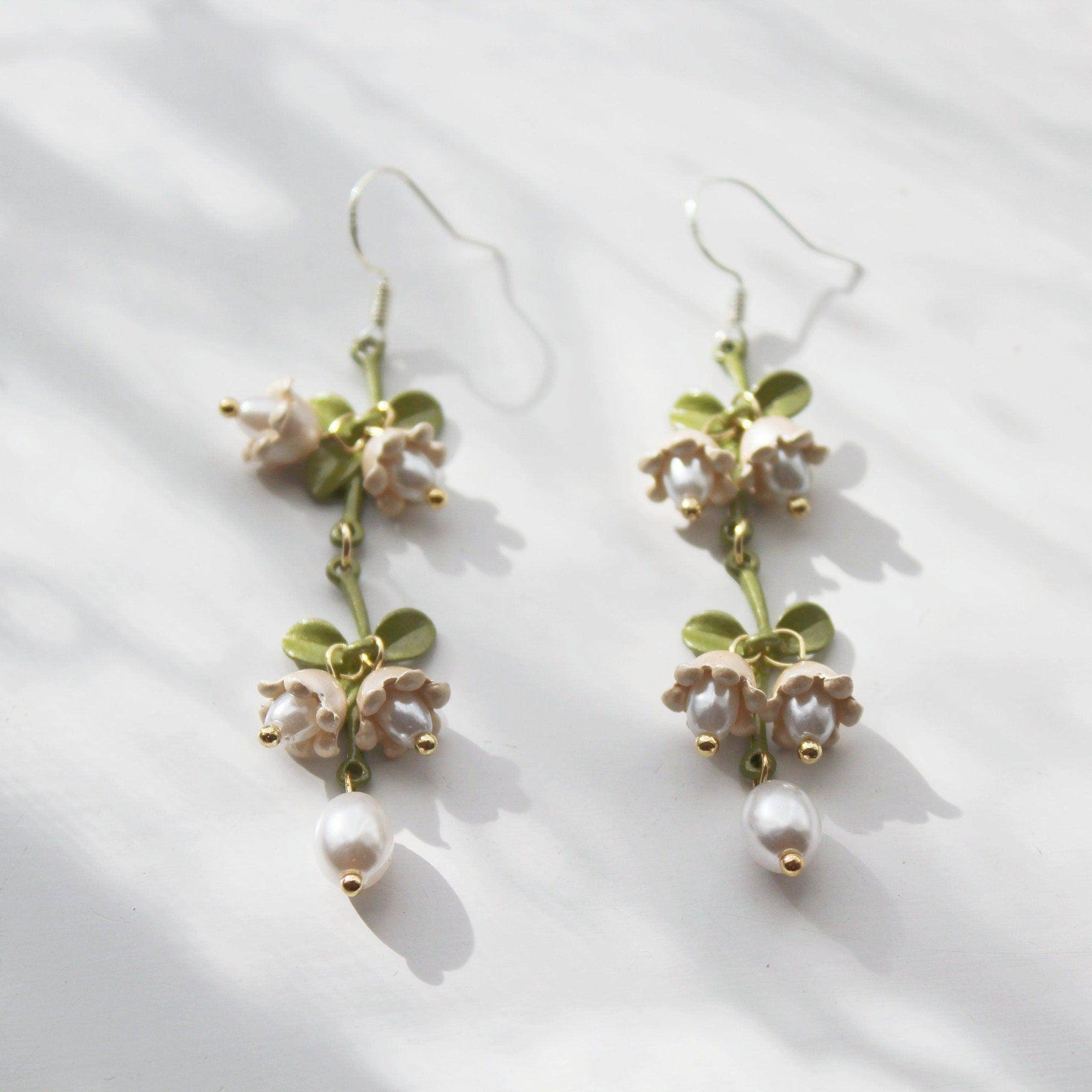 Elegant Campanula Bellflower Drop Earrings featuring bell-shaped flowers and green leaves, crafted from sterling silver and bronze.