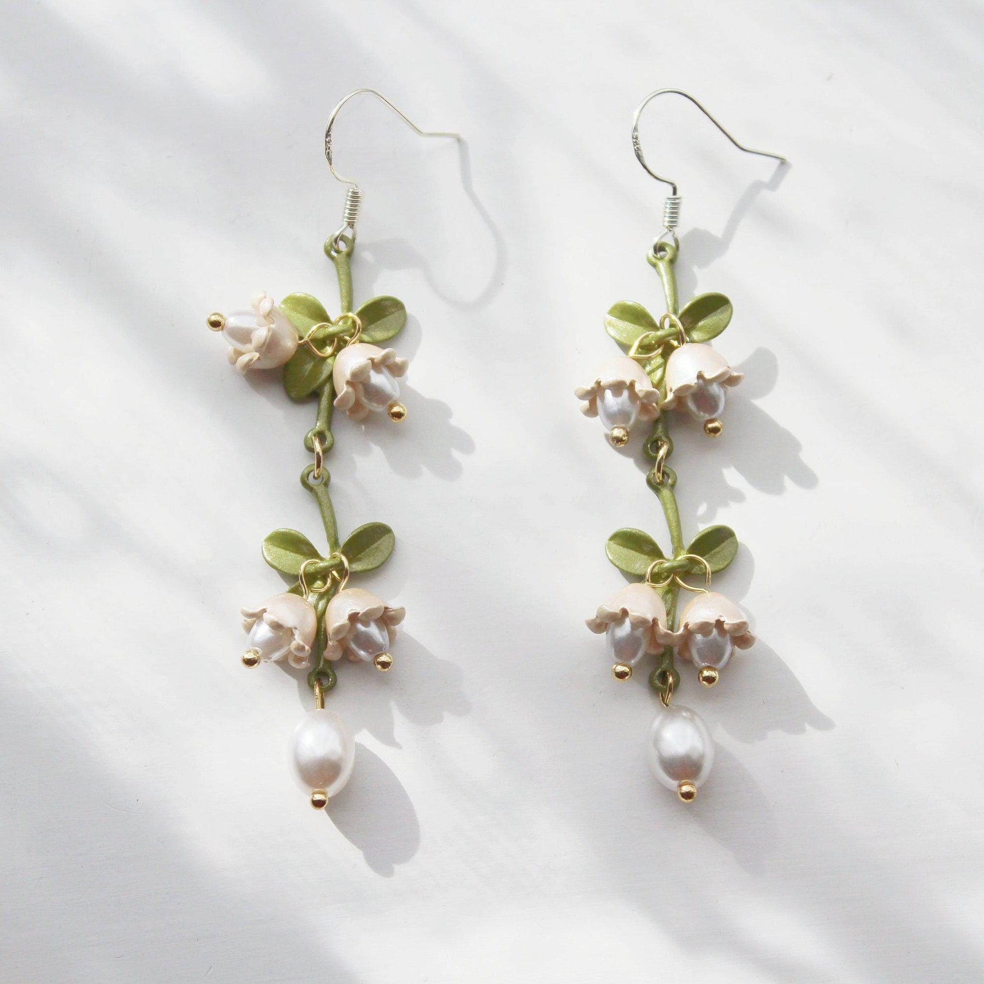 Elegant Campanula Bellflower Drop Earrings featuring bell-shaped flowers and green leaves, crafted from sterling silver and bronze.