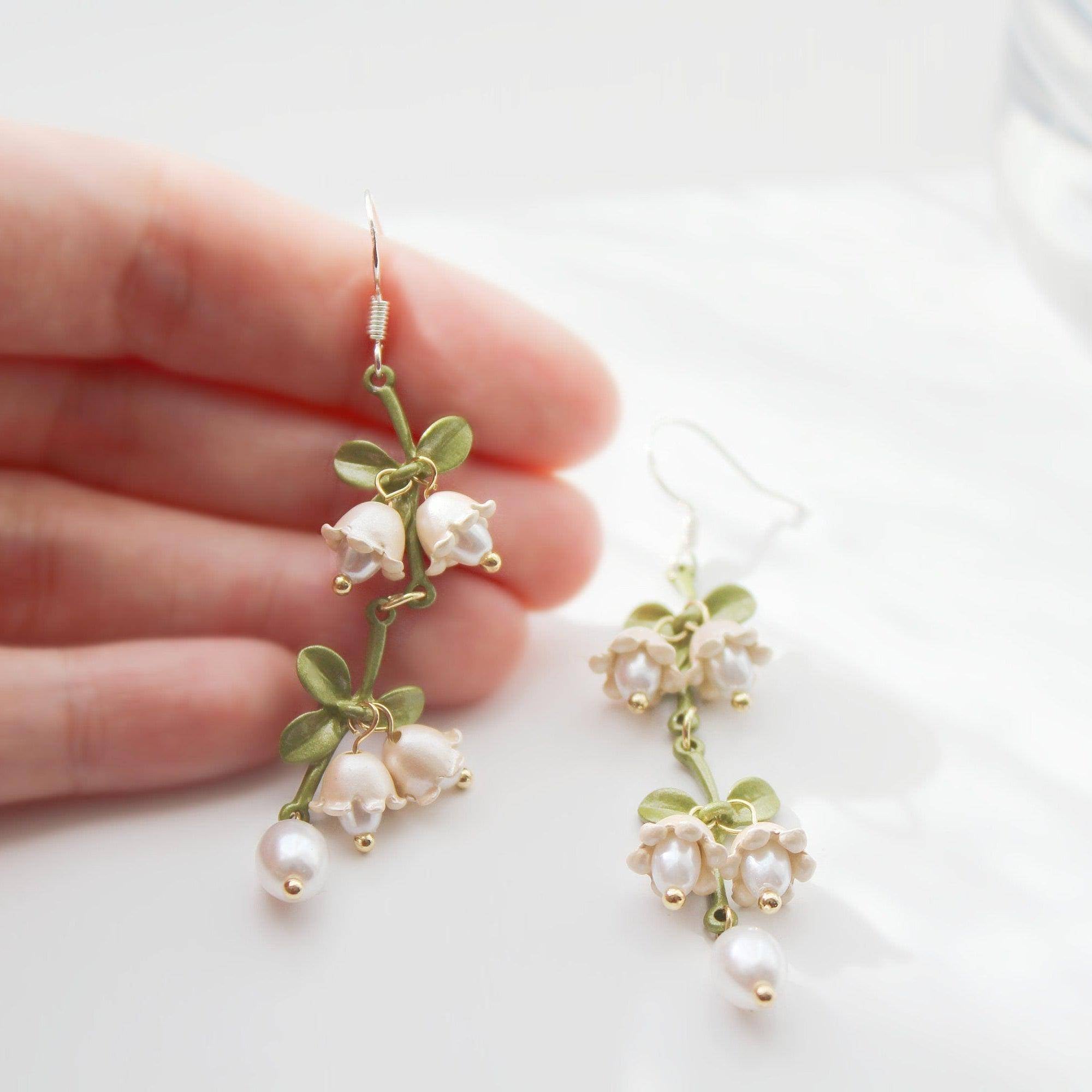 Elegant Campanula Bellflower Drop Earrings featuring bell-shaped flowers and green leaves, crafted from sterling silver and bronze.