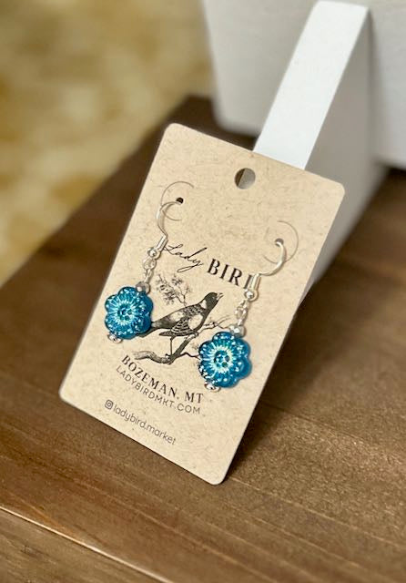 Capri Blue and Silver Etched Glass Wild Rose Flower Dangle Earrings showcasing intricate etching and a vintage-inspired design.