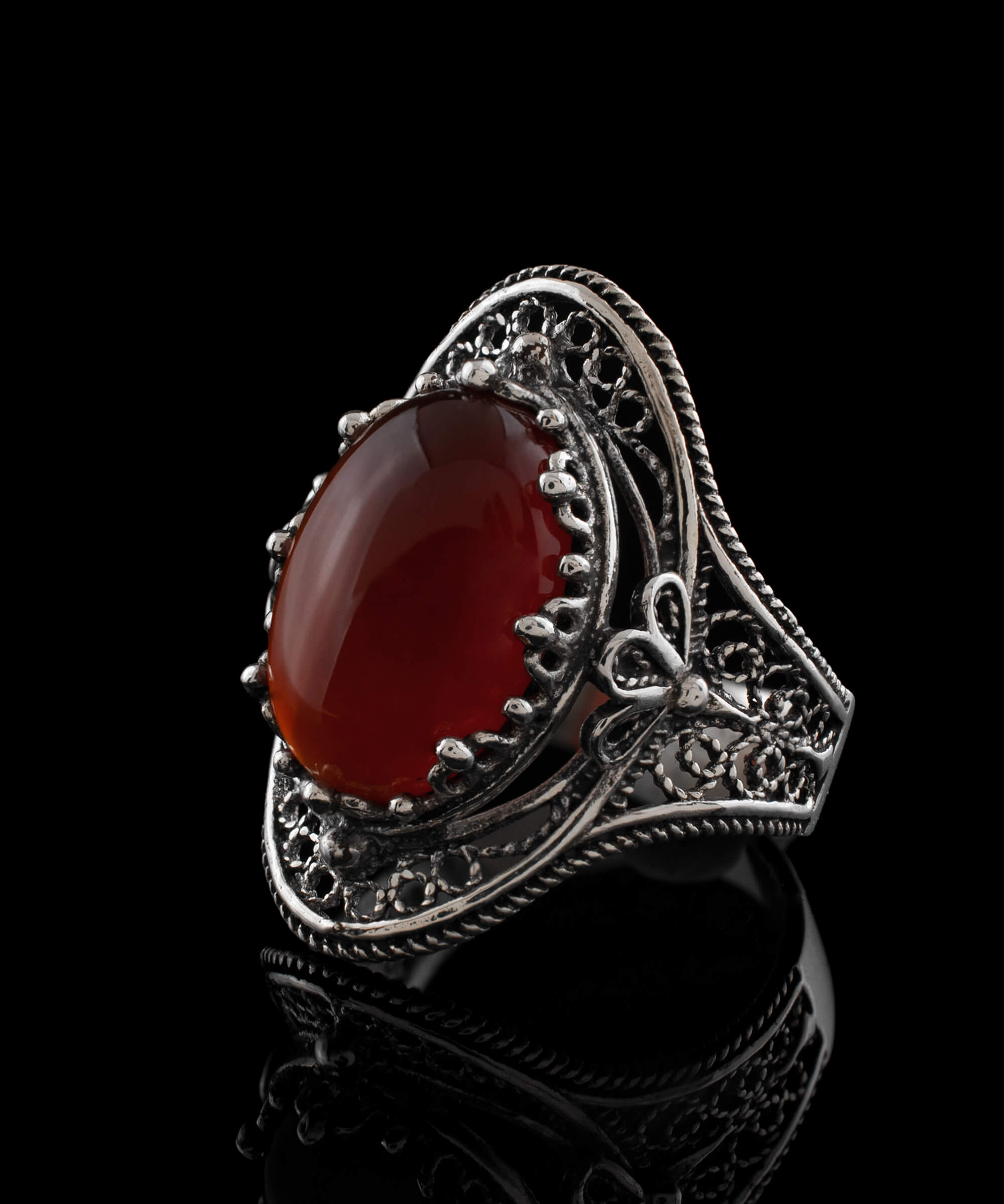 Carnelian Gemstone Filigree Art Woman Silver Statement Ring featuring an oval cut carnelian and intricate daisy filigree design.