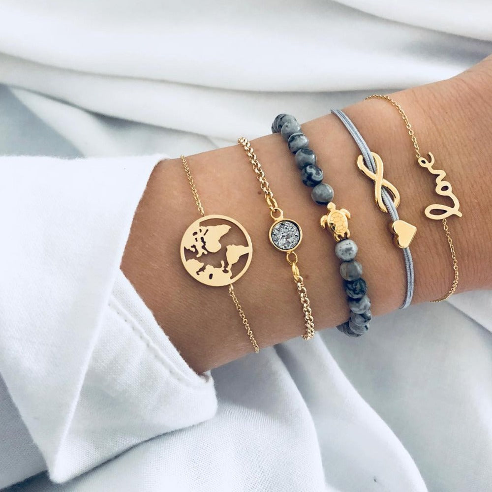 Celestial Marble Crystals and Gemstone 5 Piece Bracelet Set featuring 14K gold plating, black marble design, and white crystal accents.