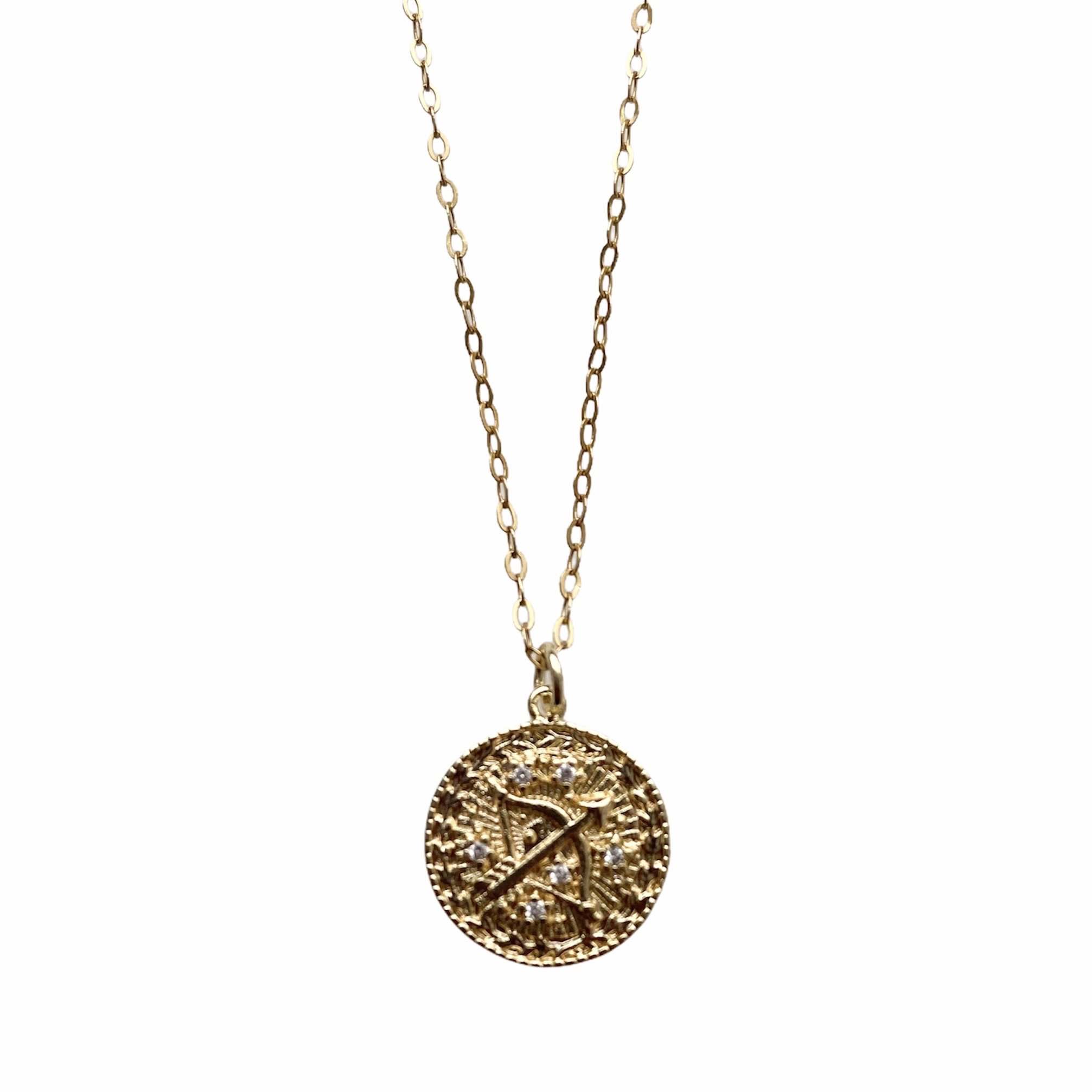 Celestial Vibes Zodiac Necklace featuring a 14K gold filled chain and zirconia encrusted pendant, elegantly displayed.