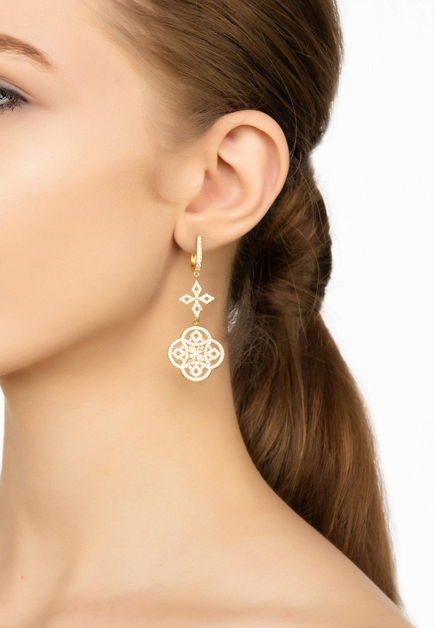 Elegant Celtic Knot Clover Drop Earrings in gold with zircon detailing, showcasing intricate design and luxurious craftsmanship.