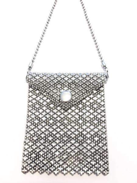 A stylish Chainmail Bag featuring intricate brass and silver plating, perfect for accessorizing any outfit.