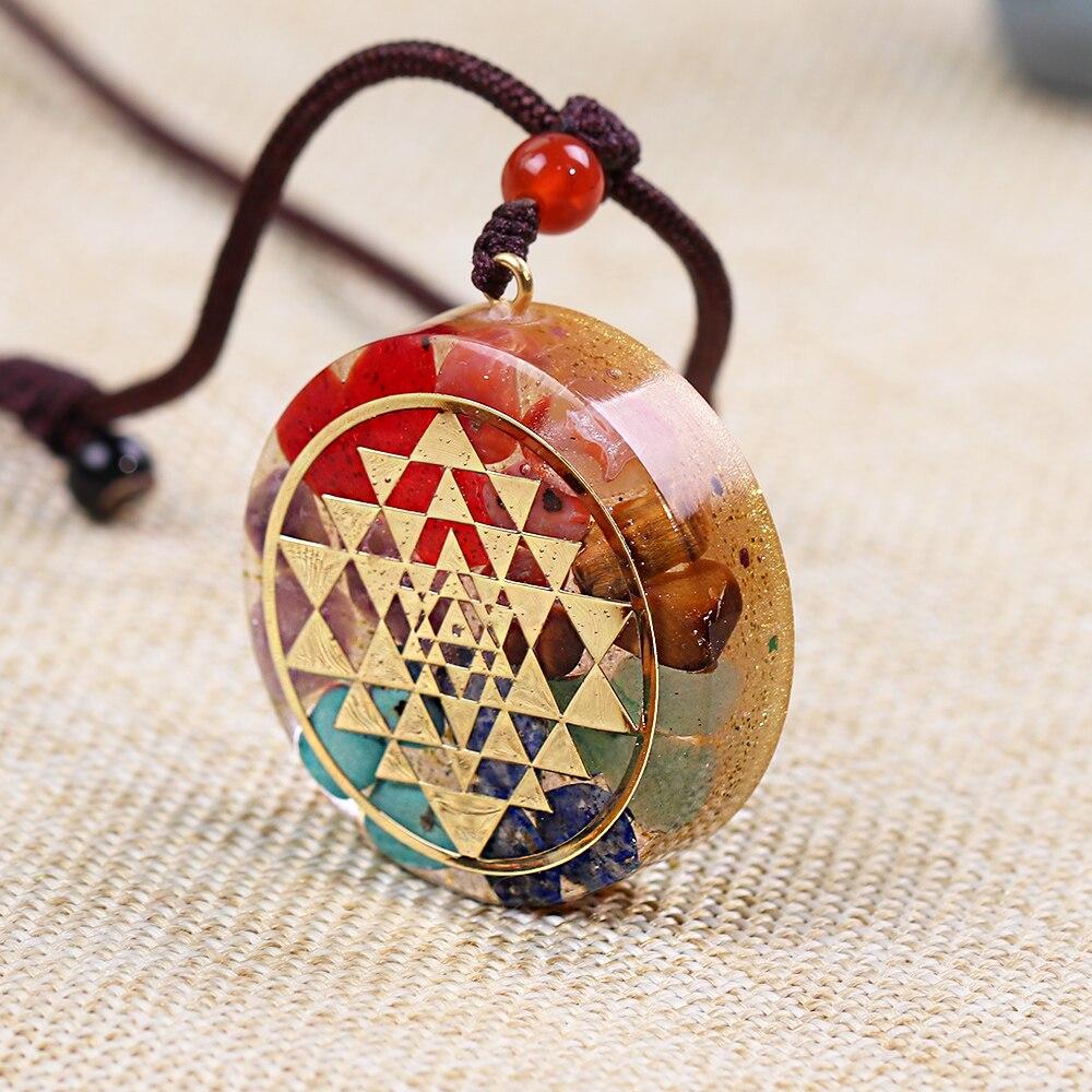 Chakra Orgonite Energy Pendant Necklace featuring Sri Yantra symbol, crafted with natural gemstones and zinc alloy.