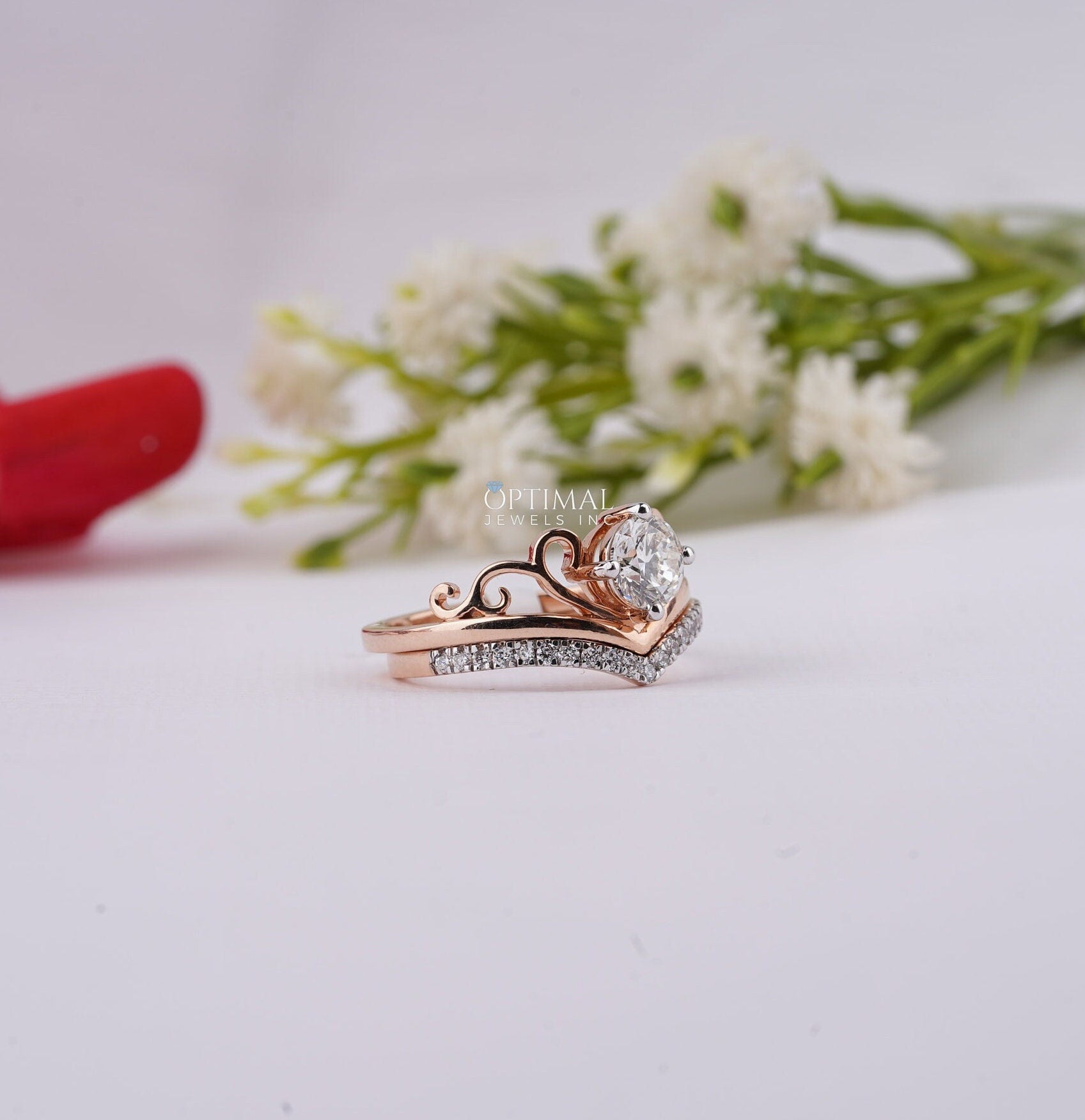 Charming Tiara Style Engagement Ring featuring a 0.96 Ctw round cut lab-created diamond in a rose gold double band design.