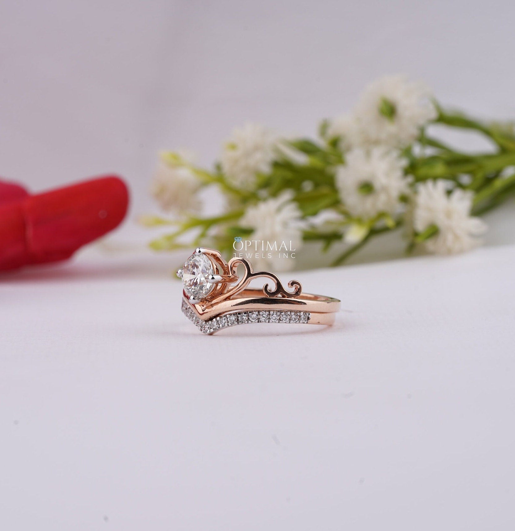 Charming Tiara Style Engagement Ring featuring a 0.96 Ctw round cut lab-created diamond in a rose gold double band design.