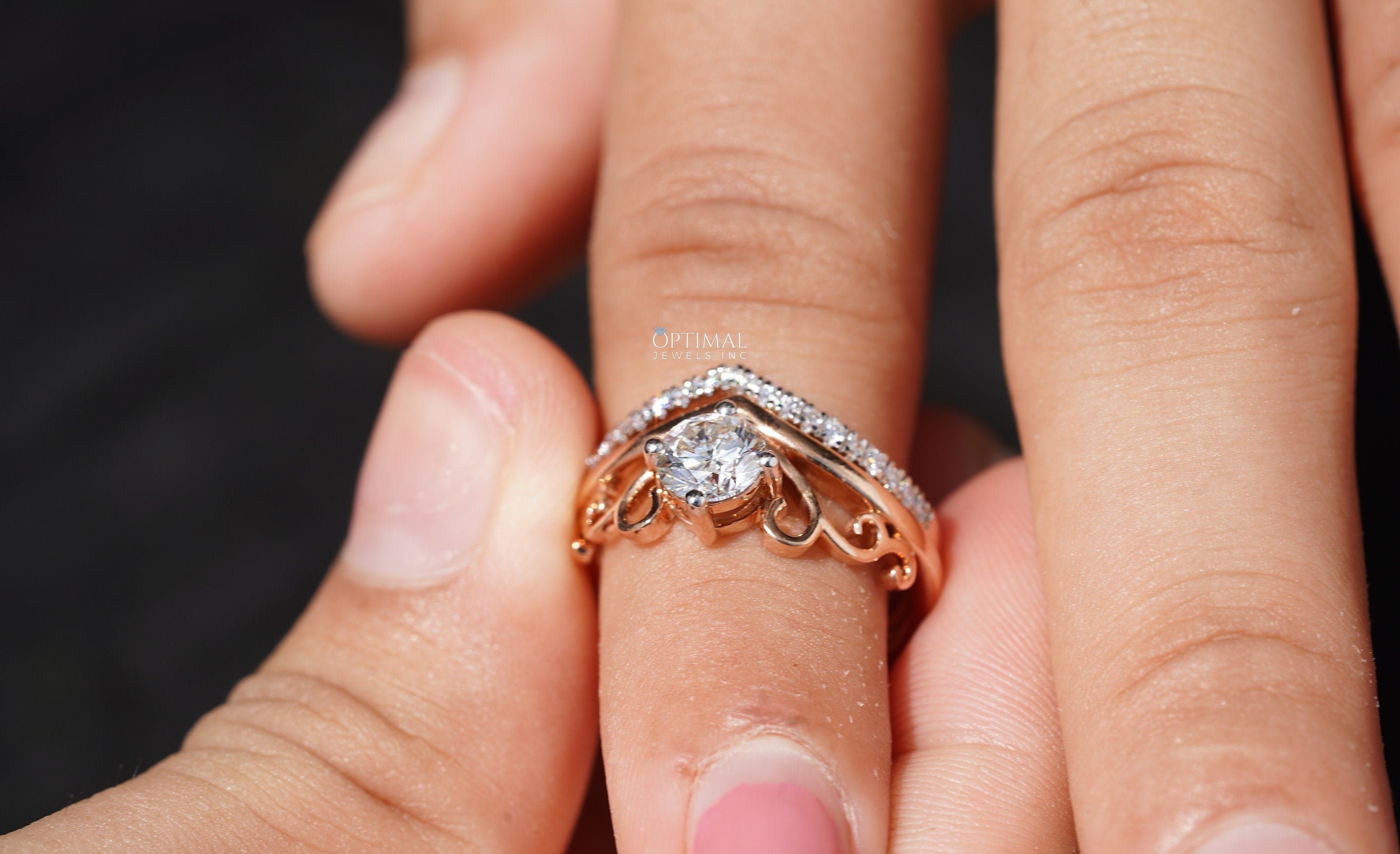 Charming Tiara Style Engagement Ring featuring a 0.96 Ctw round cut lab-created diamond in a rose gold double band design.