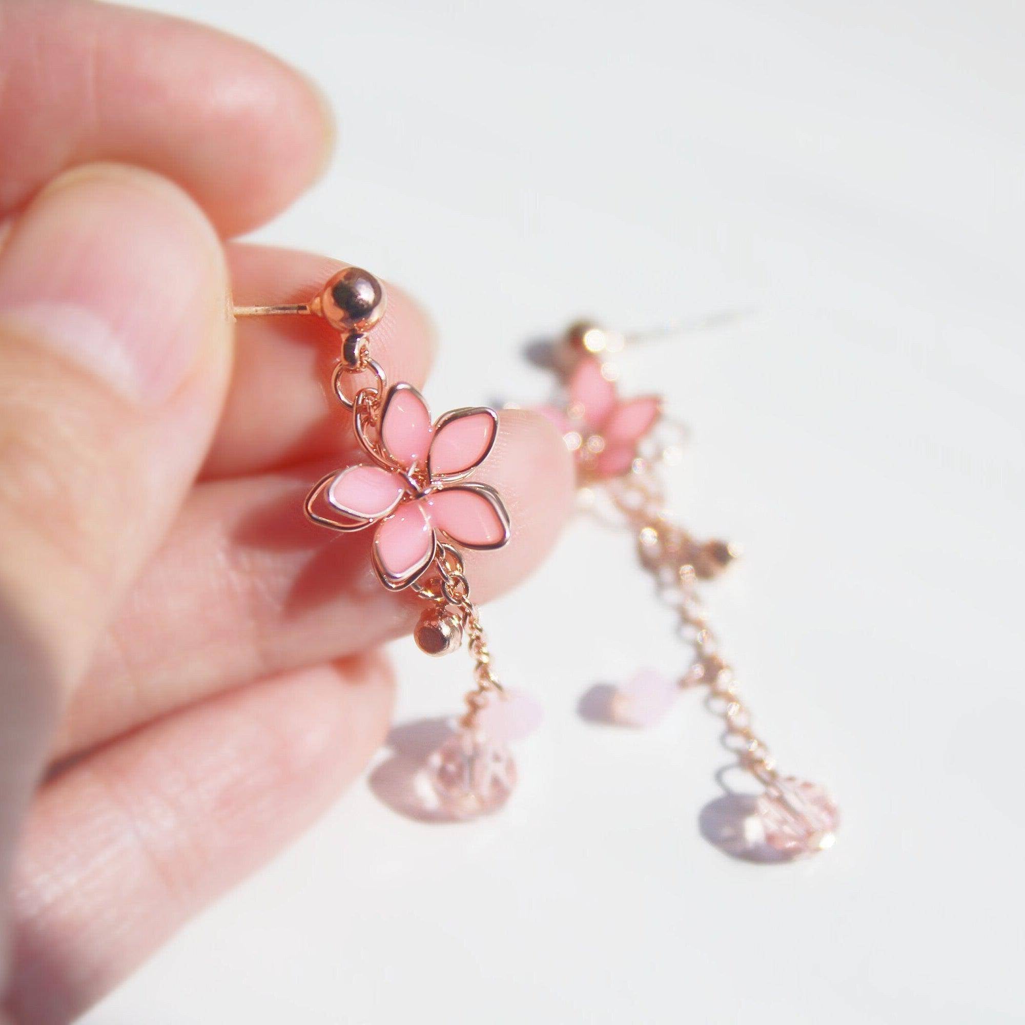 Handmade pink five-petal flower dangle drop earrings with rose gold wire and sterling silver studs, elegantly displayed in a gift box.